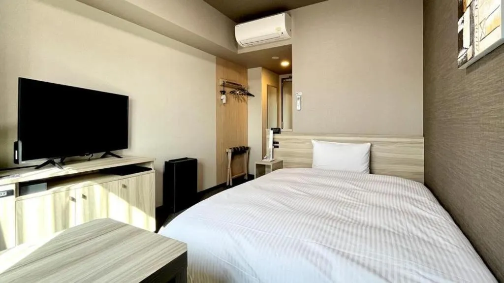 Bed in Hotel Route Inn Miyakonojo