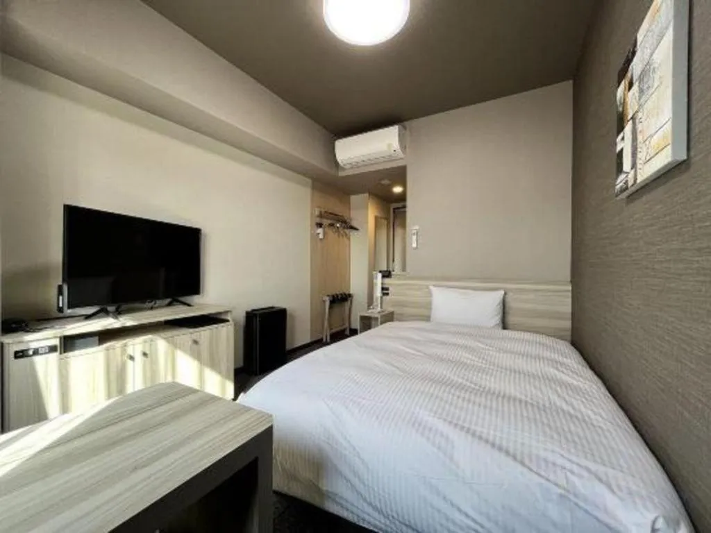 Bed in Hotel Route Inn Miyakonojo