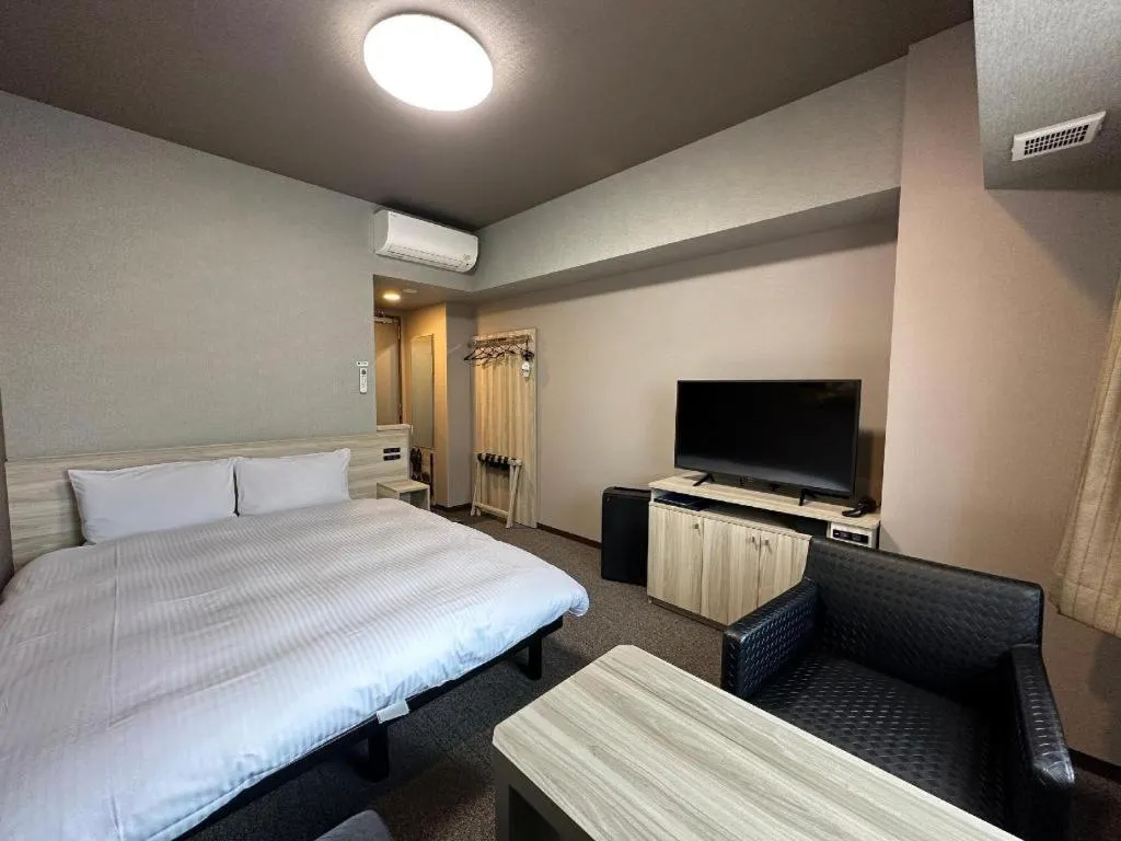 Bed in Hotel Route Inn Miyakonojo