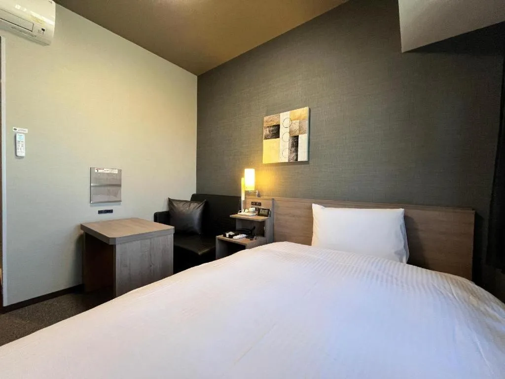 Bed in Hotel Route Inn Miyakonojo