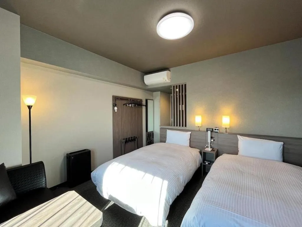 Bed in Hotel Route Inn Miyakonojo