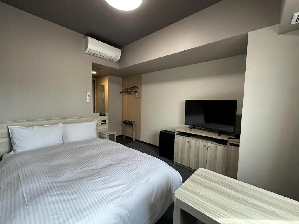 Bed in Hotel Route Inn Miyakonojo