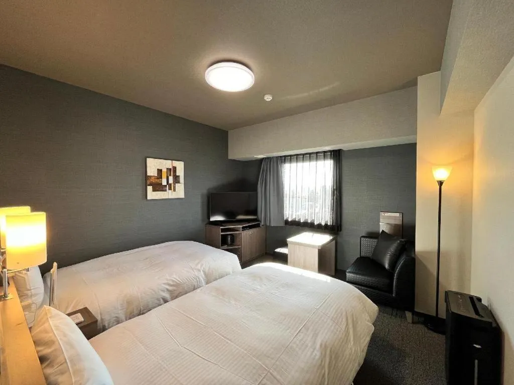 Bed in Hotel Route Inn Miyakonojo