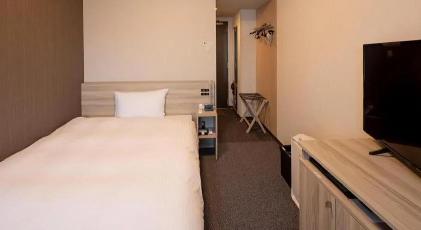 Bed in Hotel Route Inn Miyakonojo