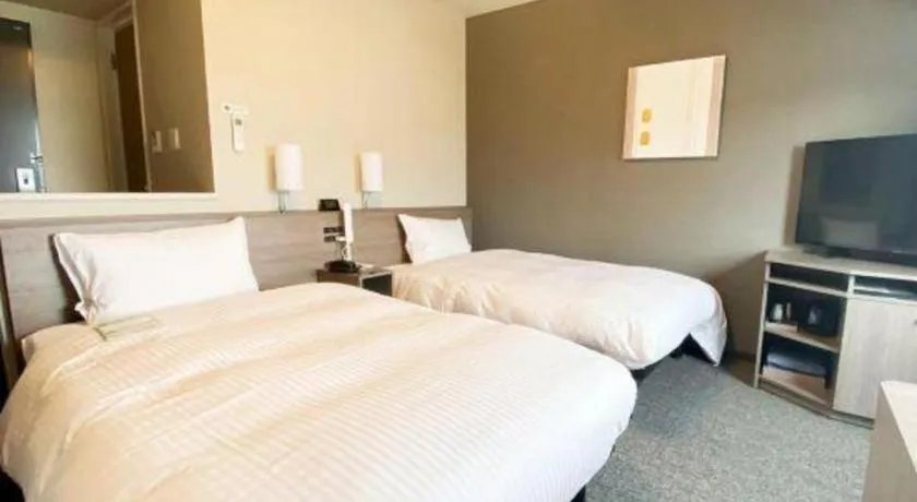 Bed in Hotel Route Inn Miyakonojo