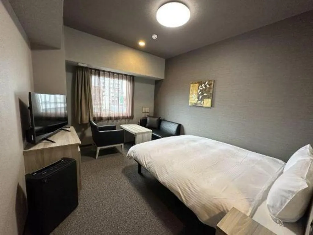 Bed in Hotel Route Inn Miyakonojo