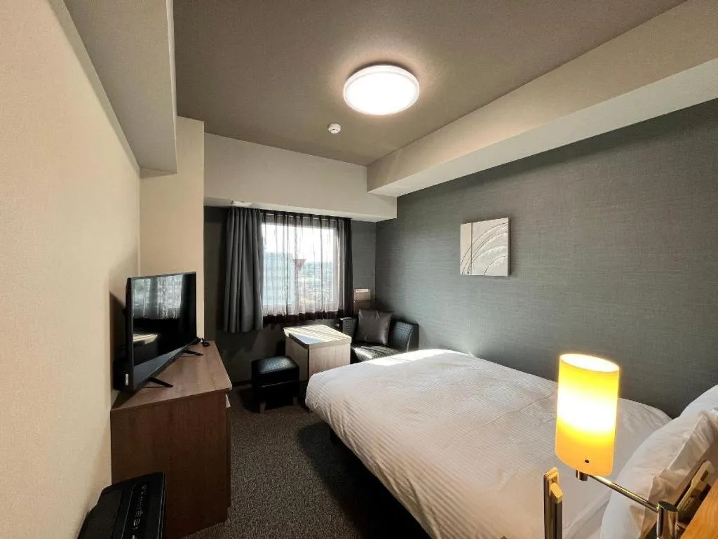 Bed in Hotel Route Inn Miyakonojo