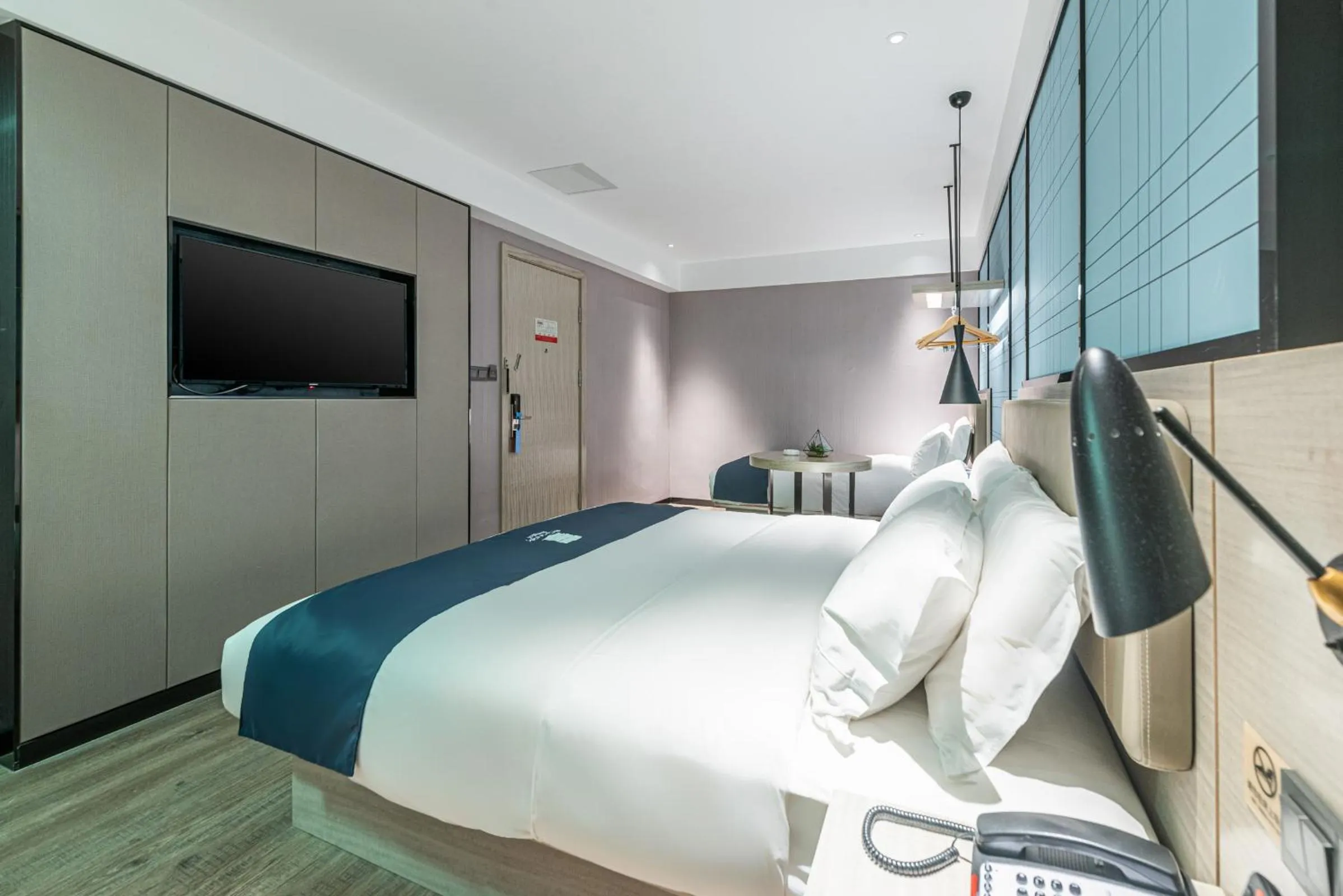 Bed in Echarm Hotel Yangshuo West Stree 宜尚酒店 阳朔西街店