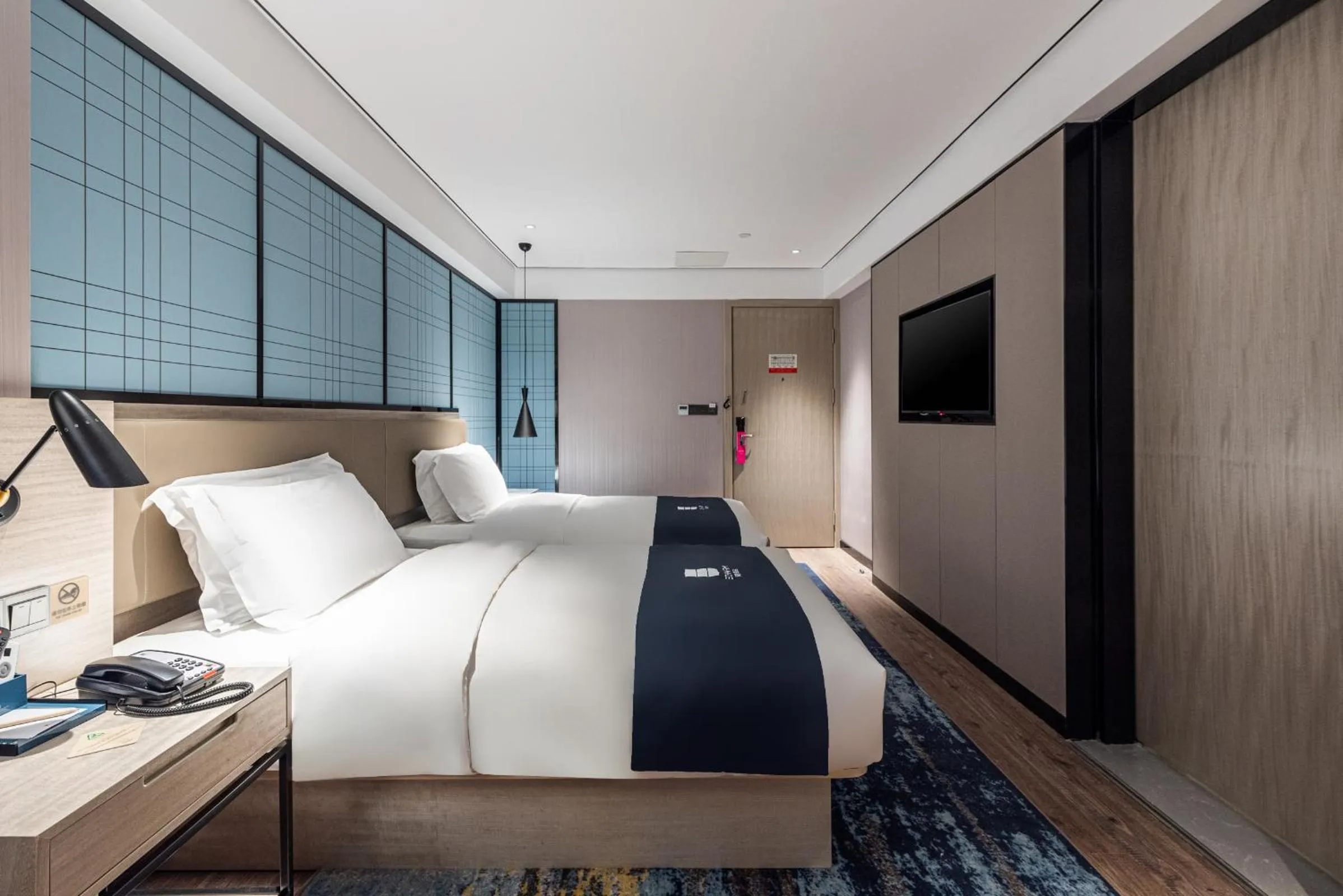 Bed in Echarm Hotel Yangshuo West Stree 宜尚酒店 阳朔西街店