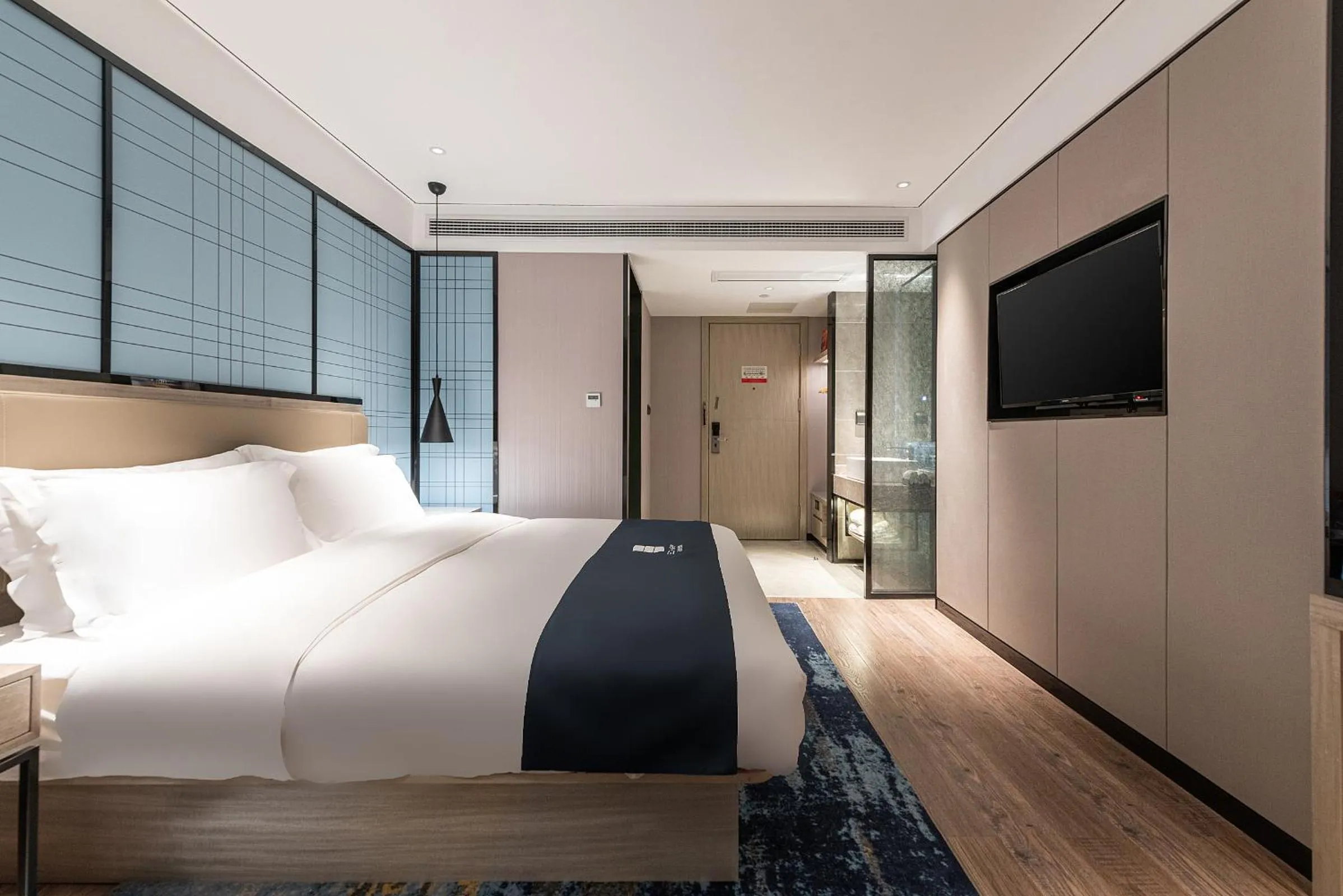 Bed in Echarm Hotel Yangshuo West Stree 宜尚酒店 阳朔西街店