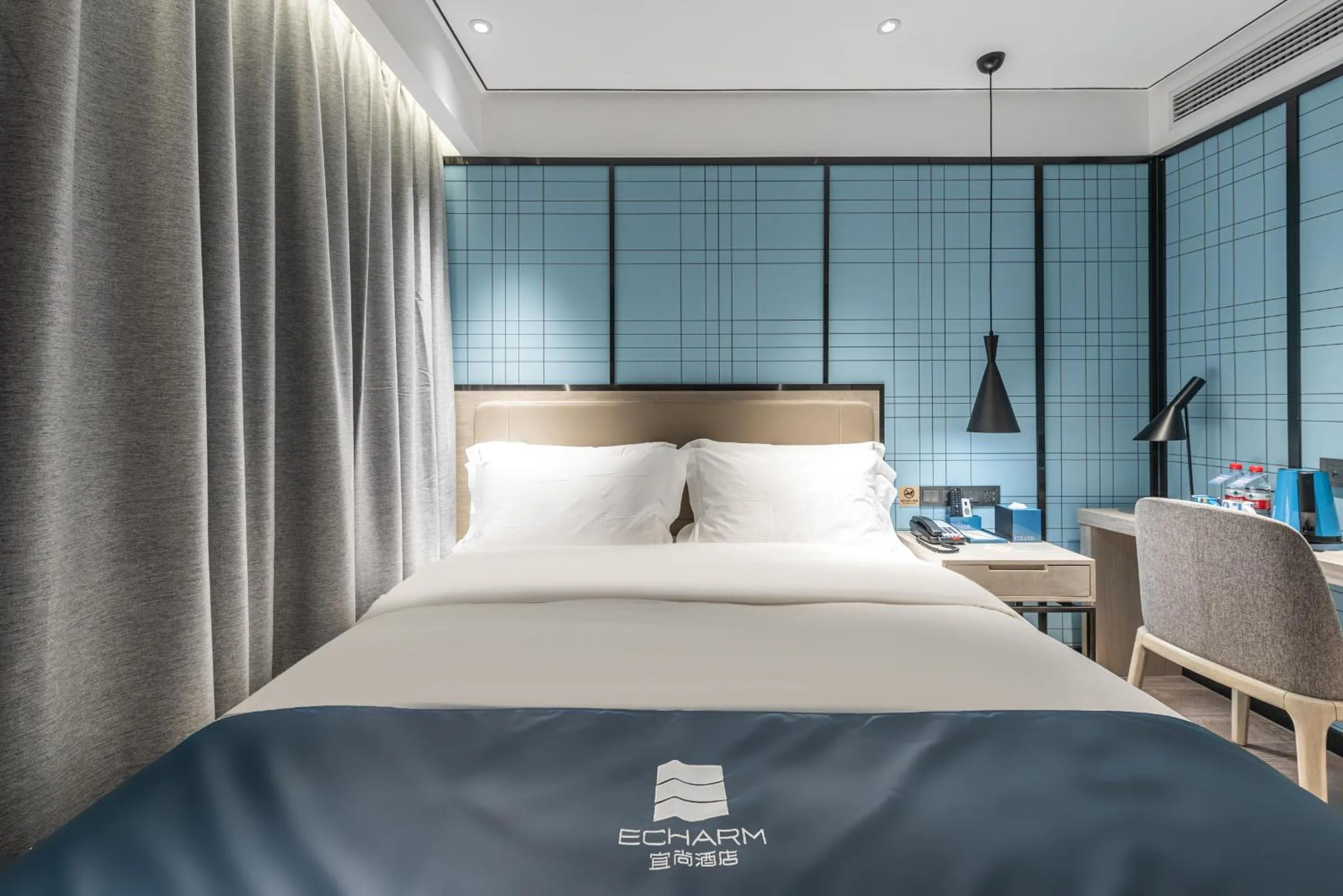 Bed in Echarm Hotel Yangshuo West Stree 宜尚酒店 阳朔西街店