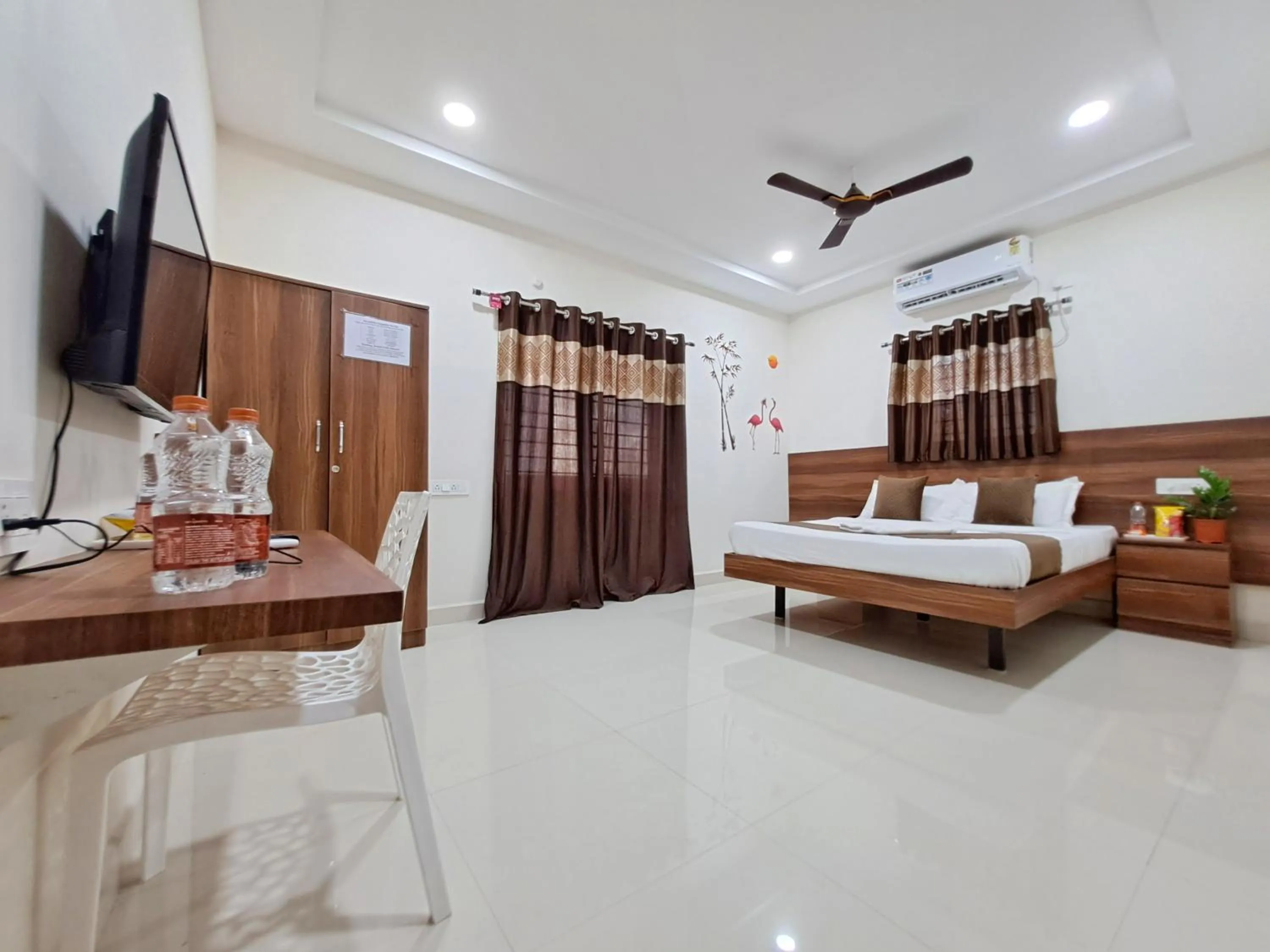 Bed in NirmalVilla Corporate Hotel