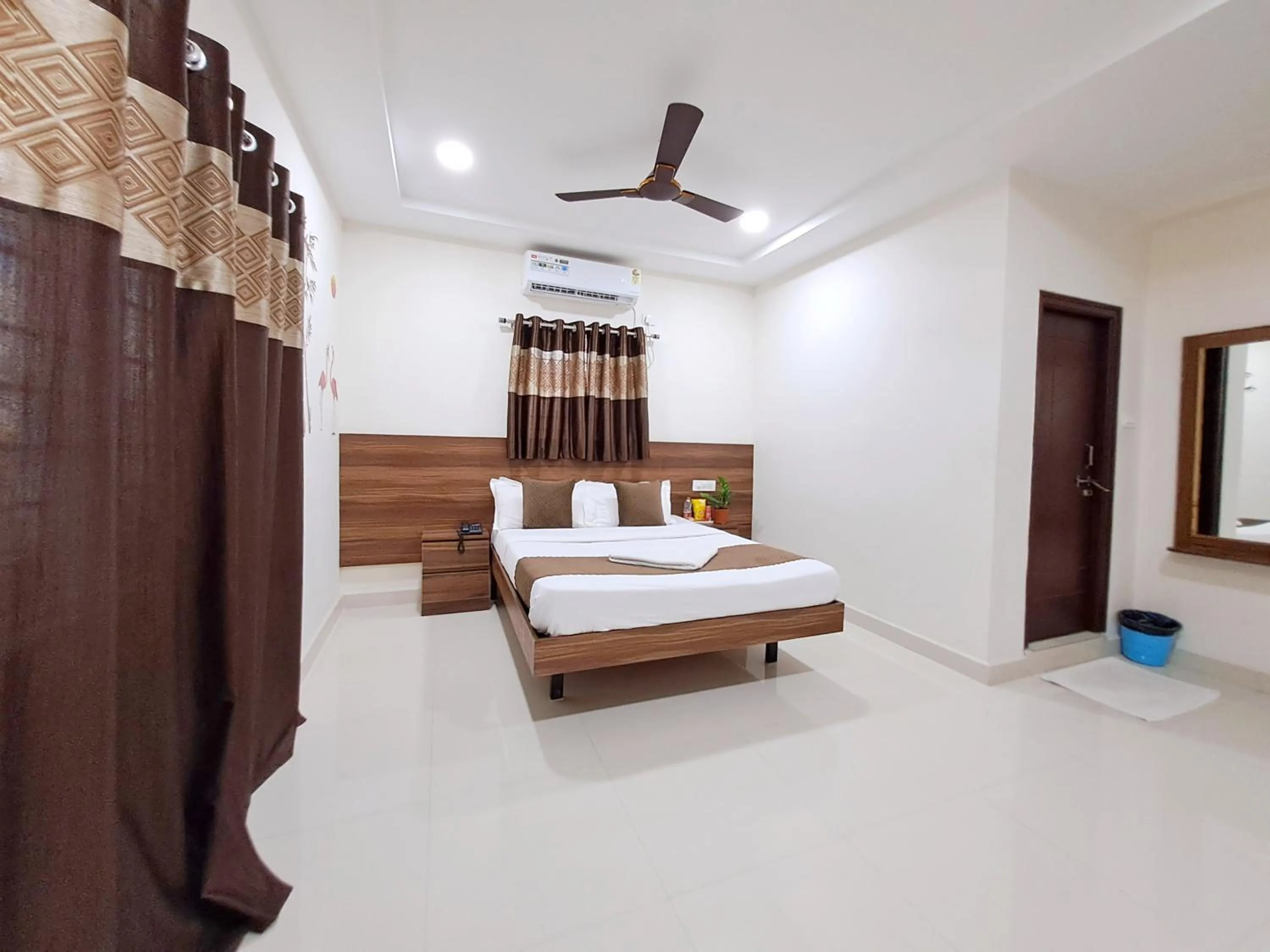 Bed in NirmalVilla Corporate Hotel