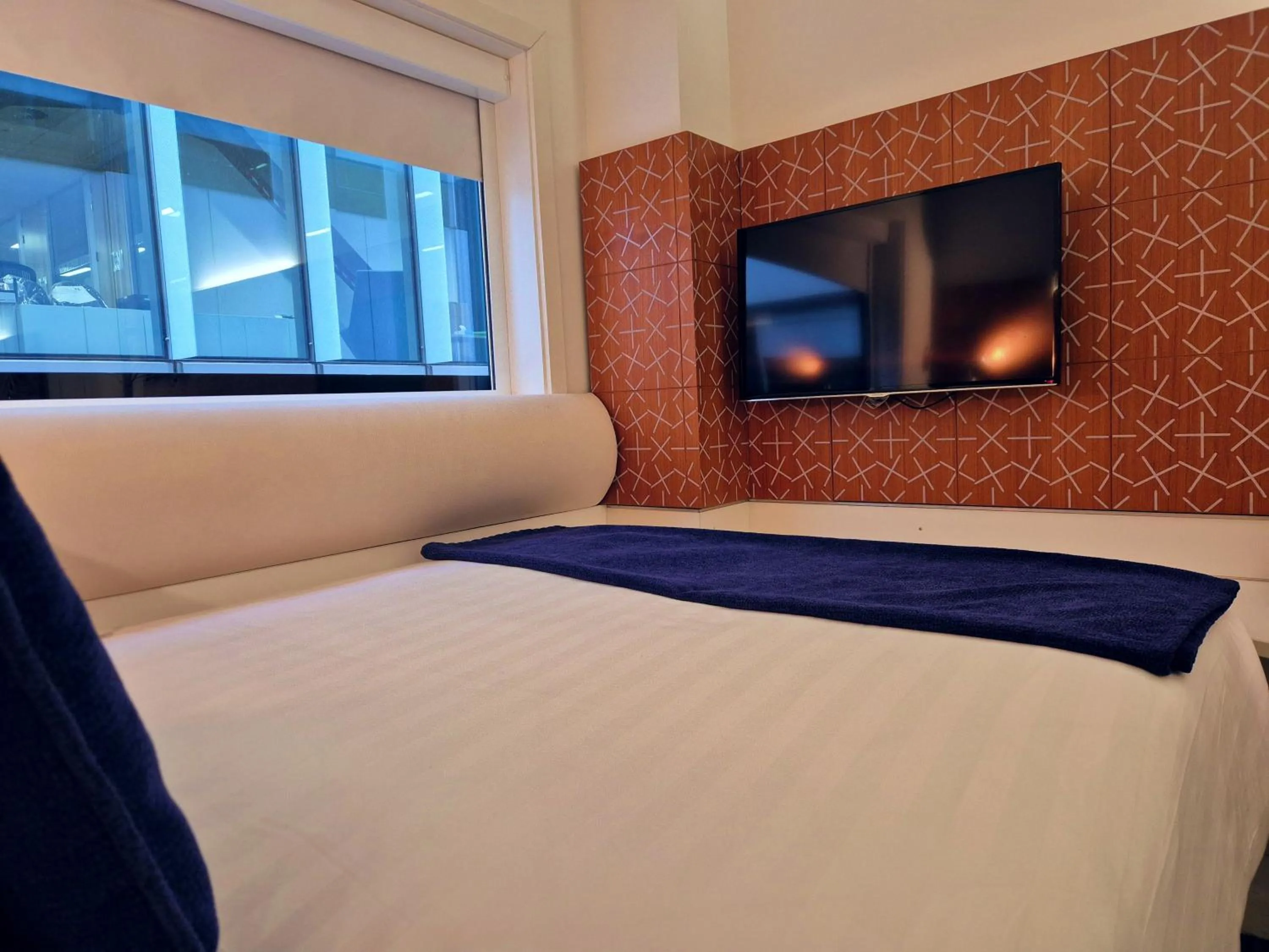 Bed in BreakFree on Cashel, an Accor Hotel