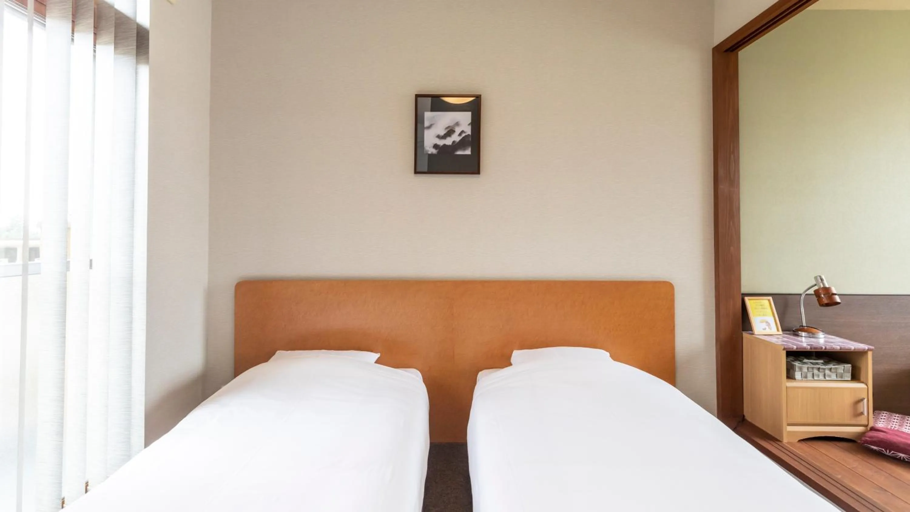 Bed in Tabist International Hotel Kaike