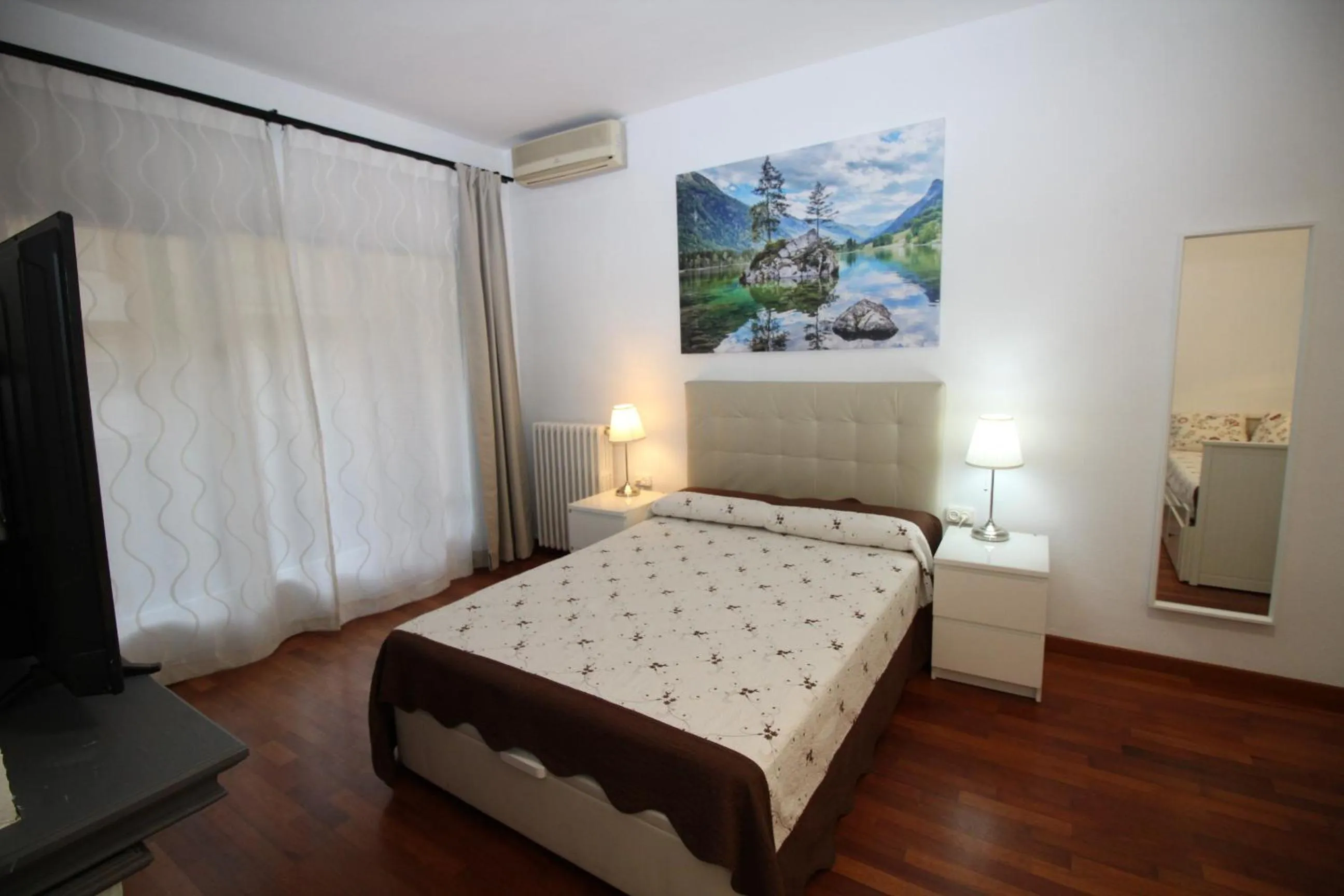 Bed in Viladomat Rooms