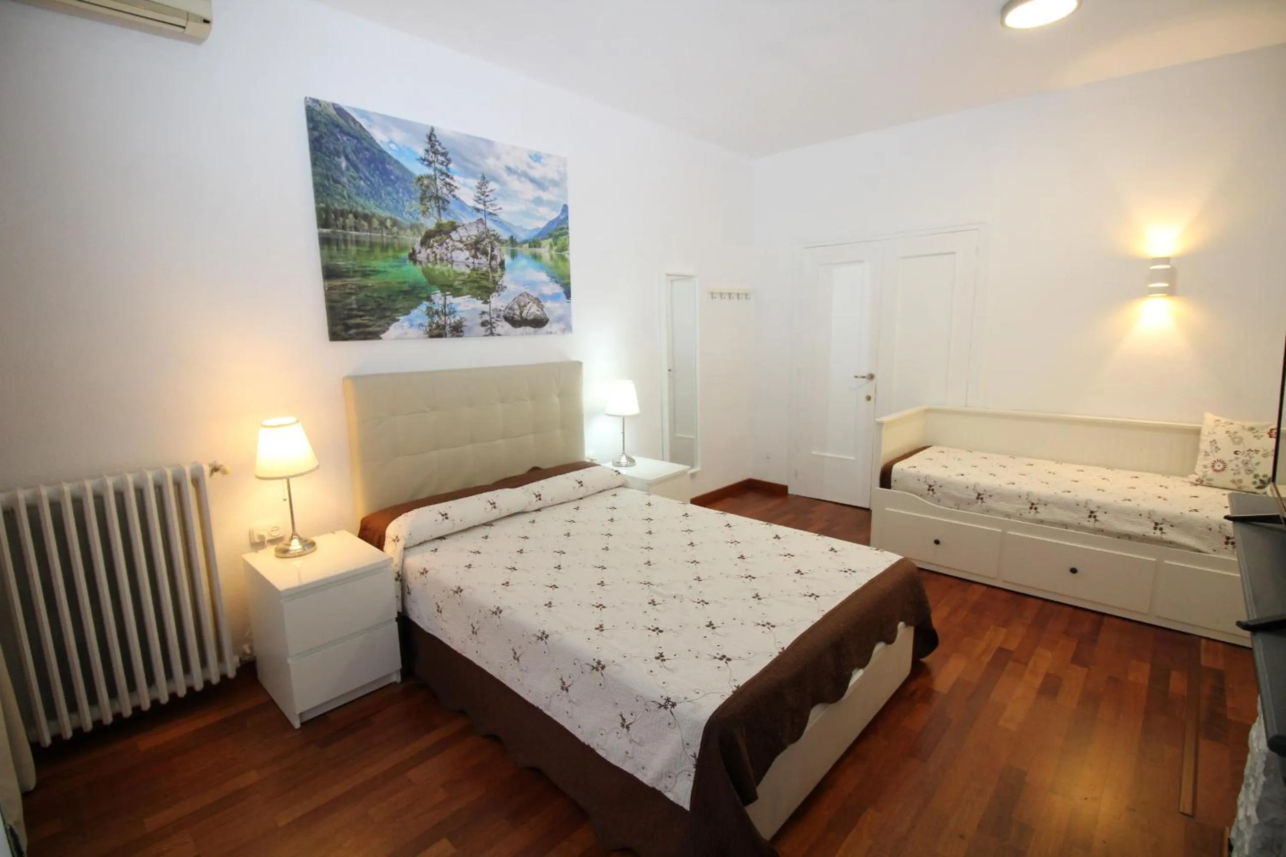 Bed in Viladomat Rooms