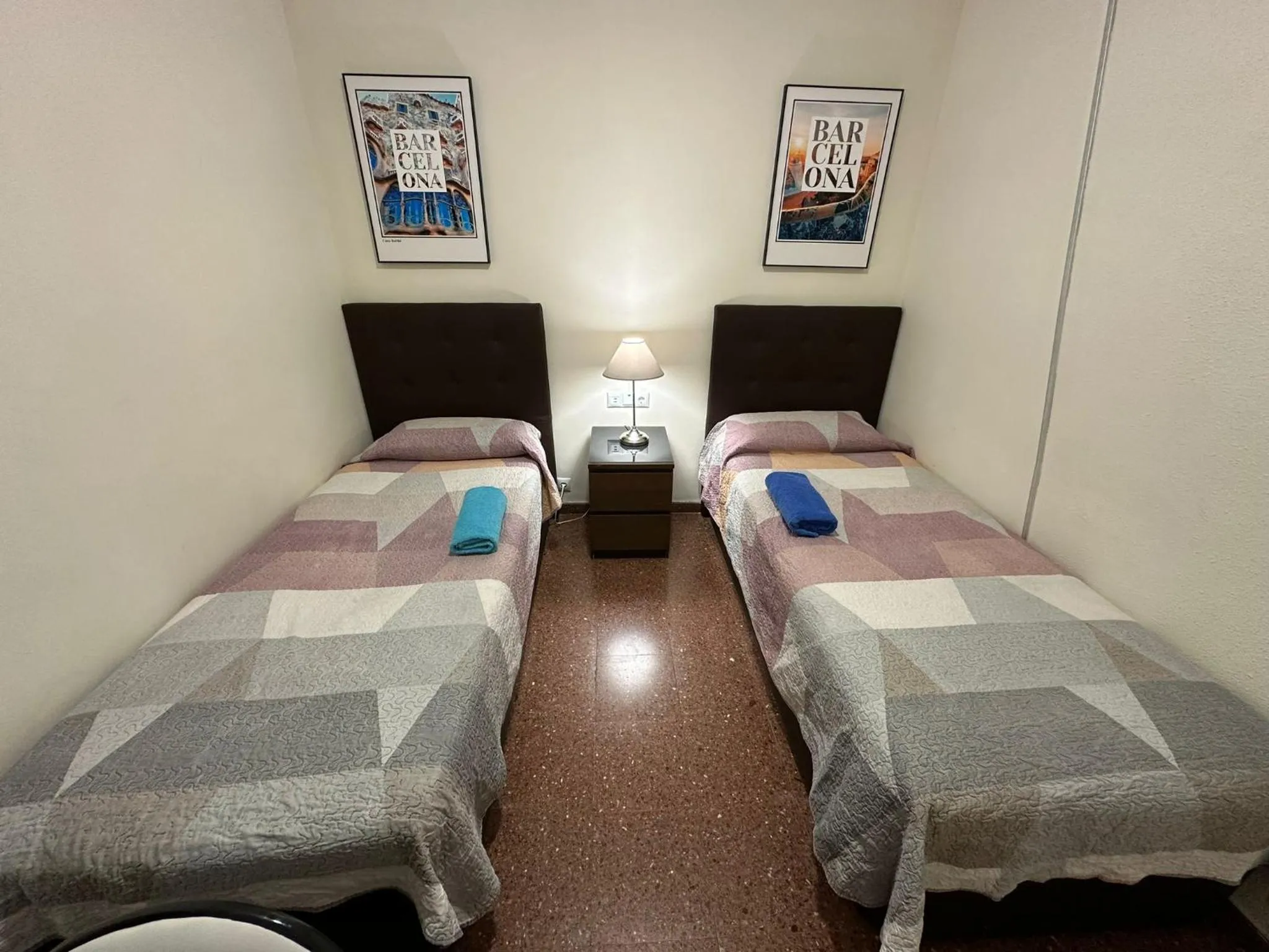 Bed in Viladomat Rooms