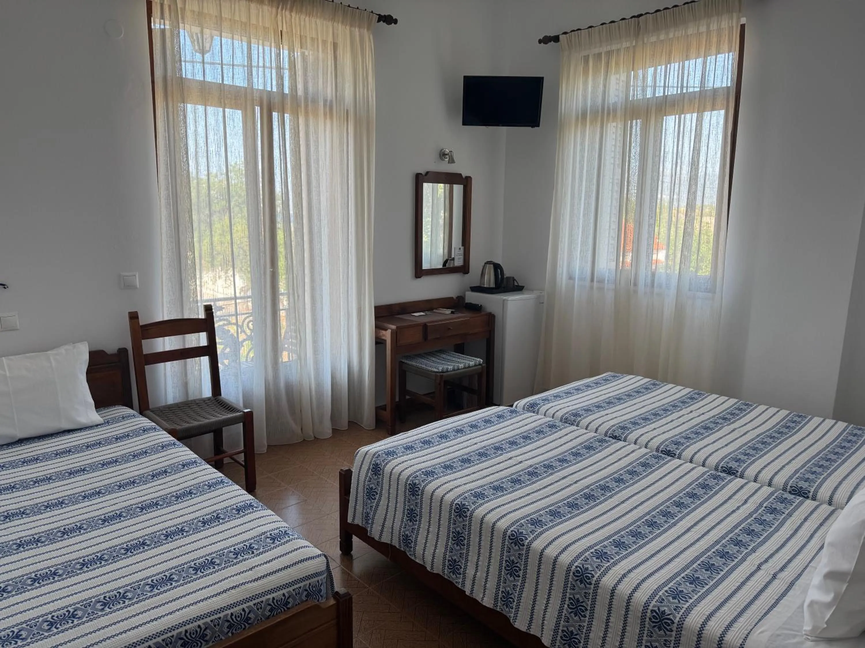 Bed in Pythaïs Hotel