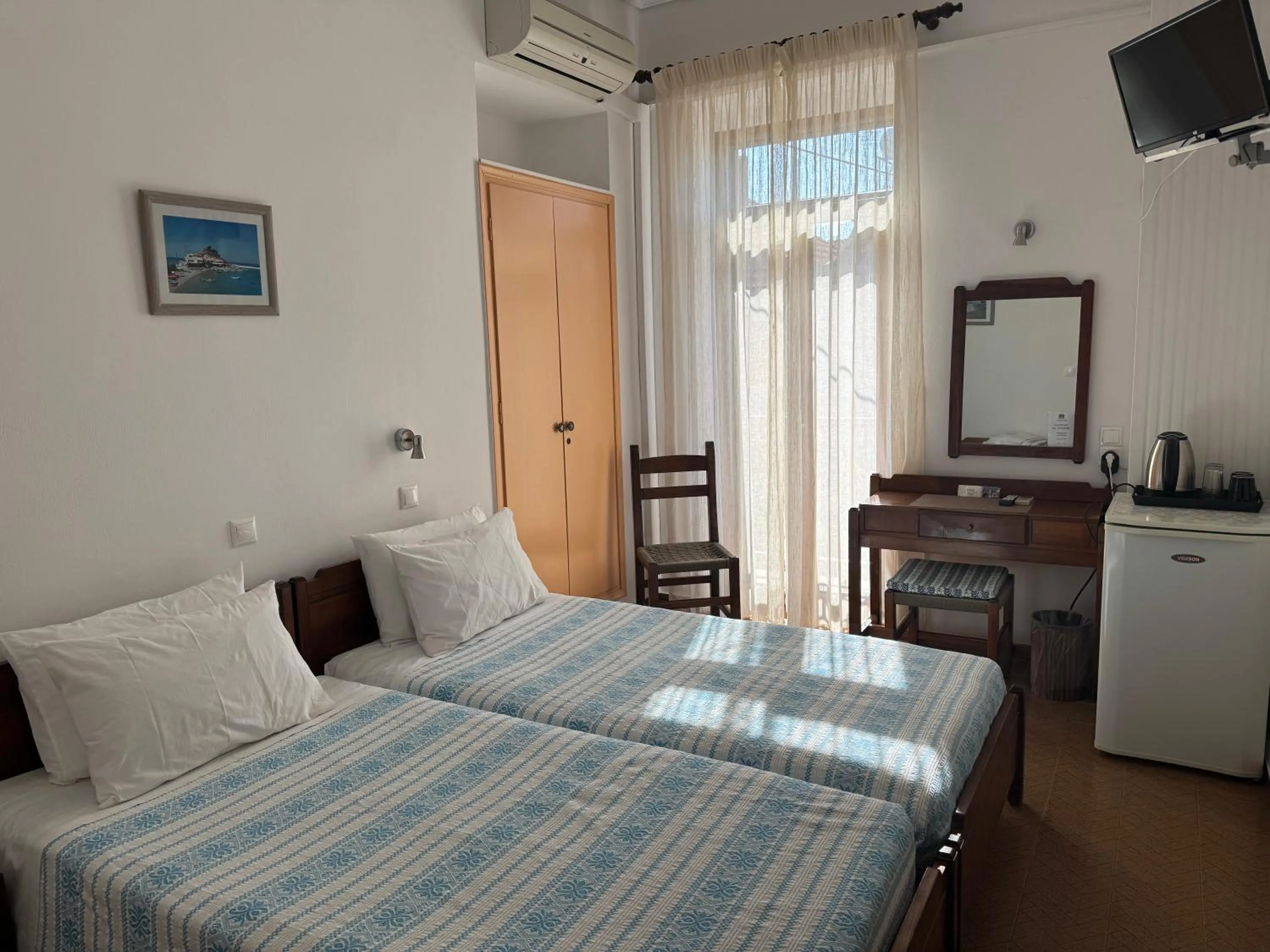 Bed in Pythaïs Hotel