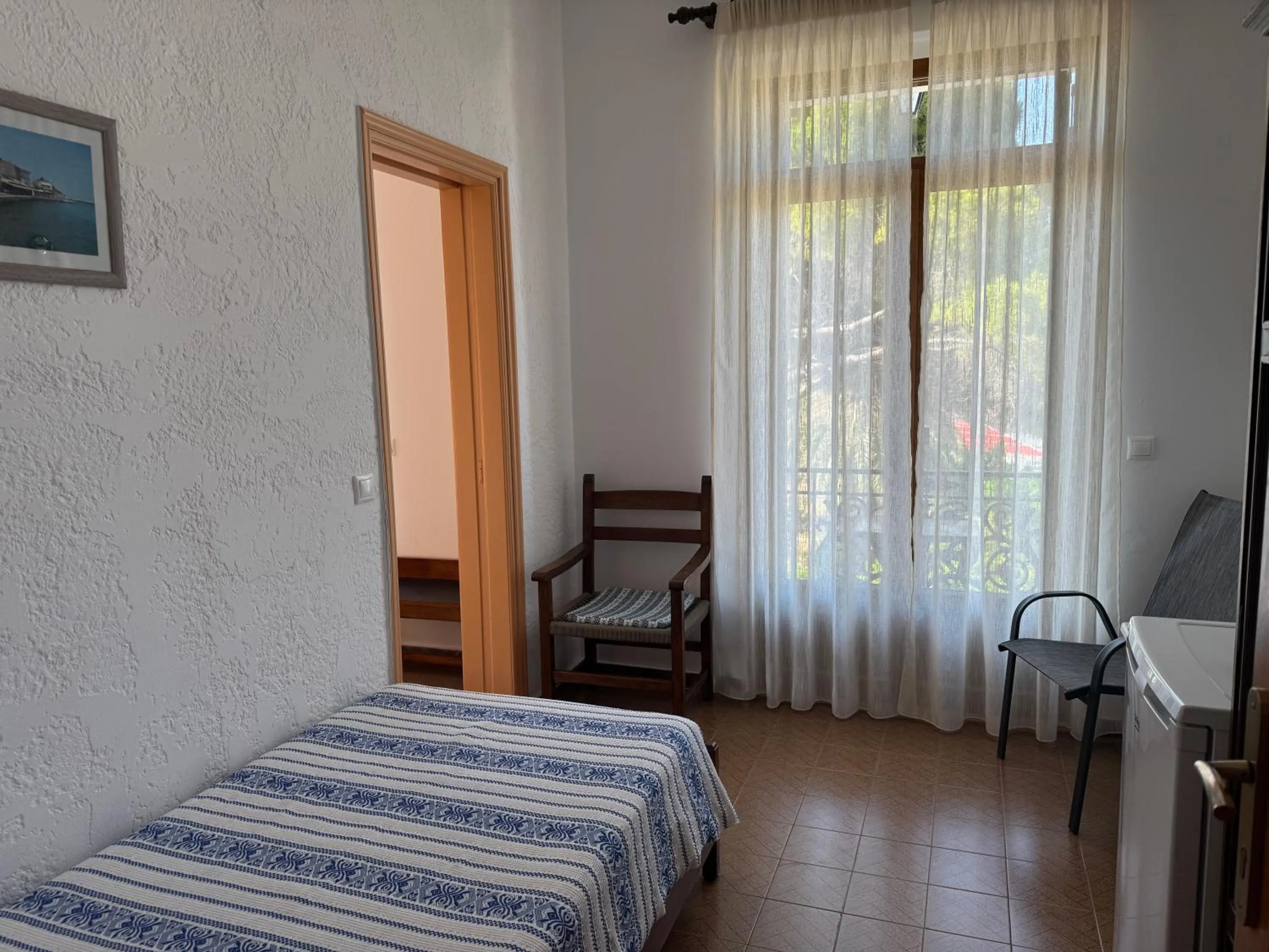 Bed in Pythaïs Hotel