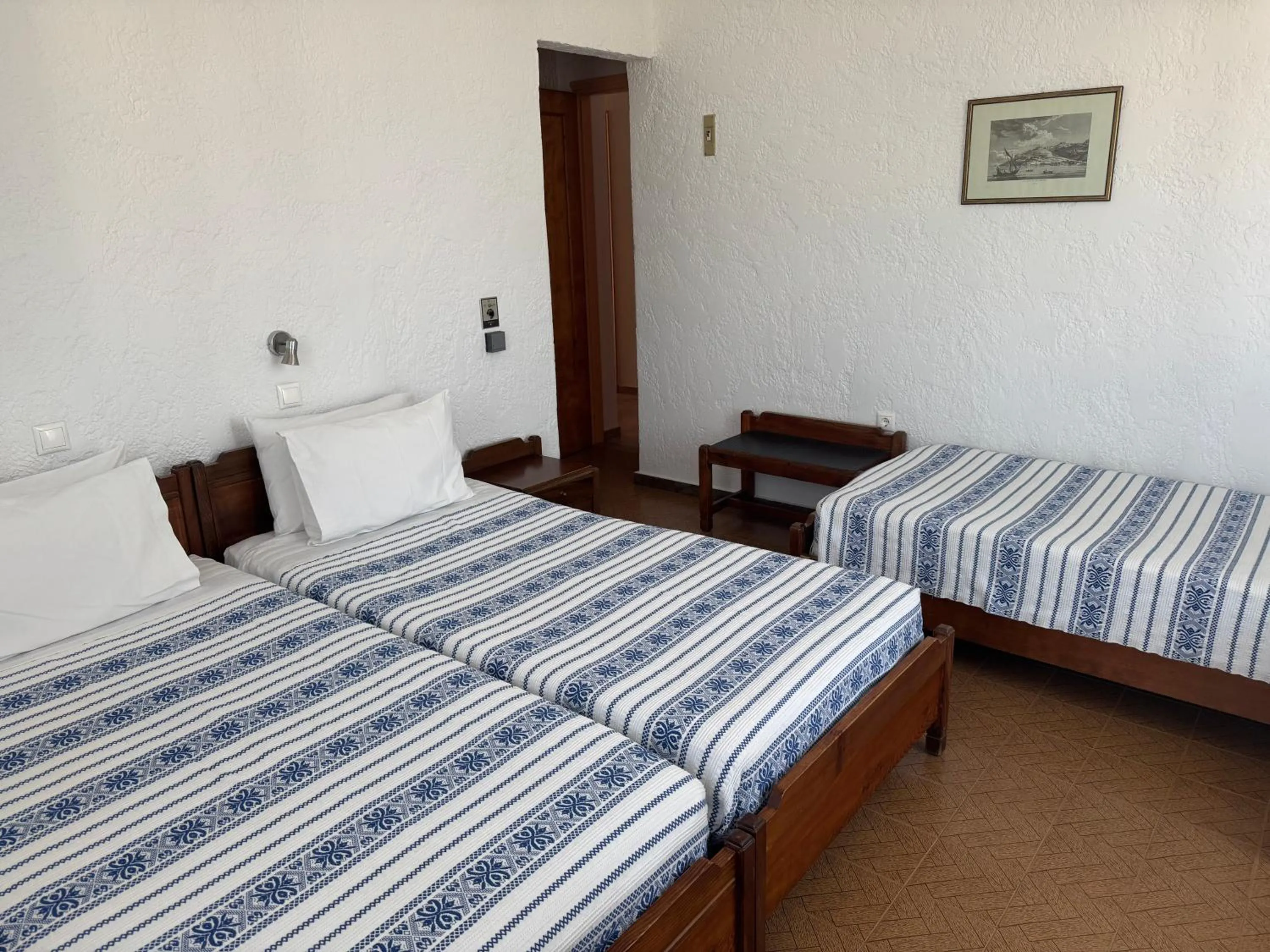 Bed in Pythaïs Hotel