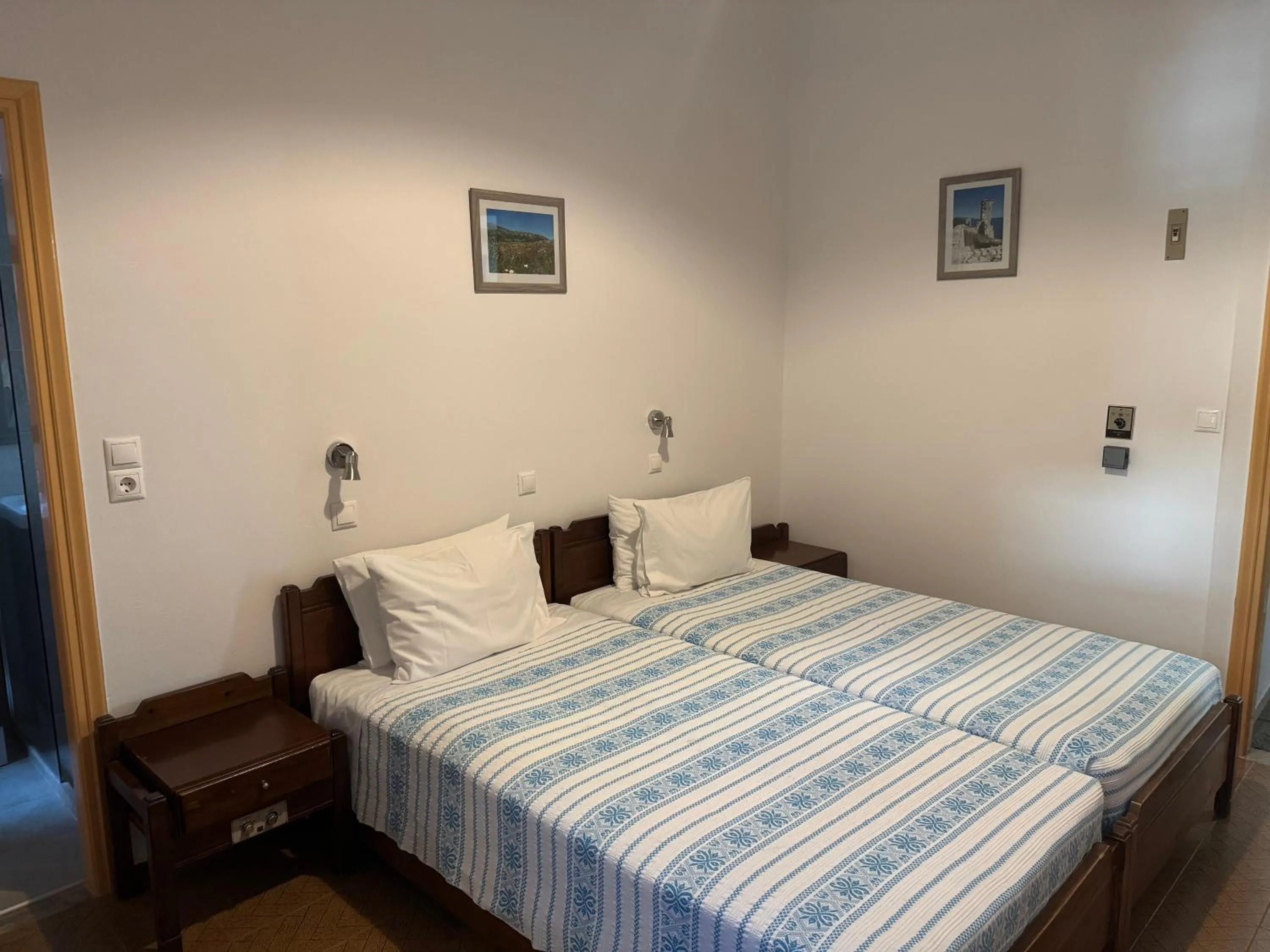 Bed in Pythaïs Hotel