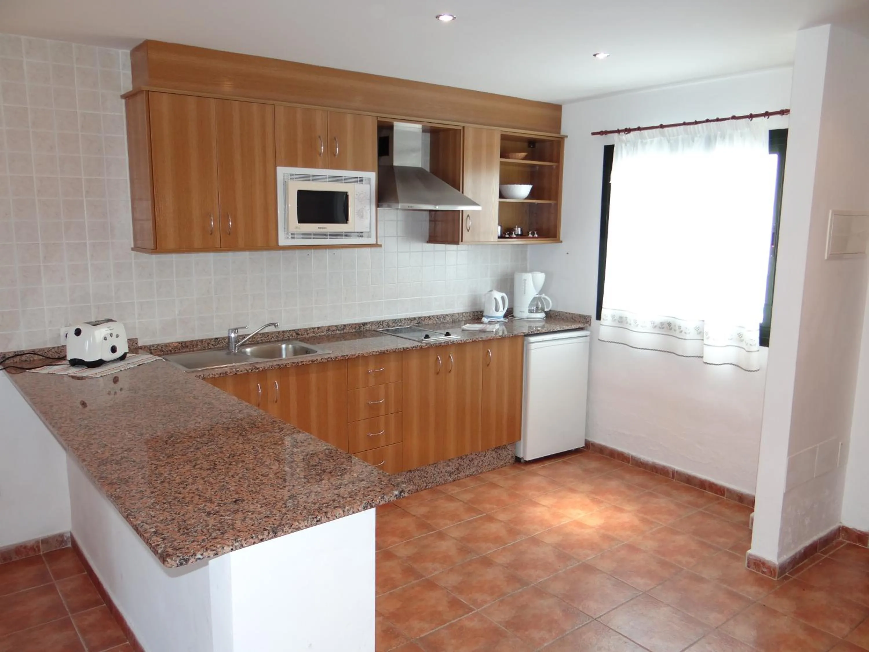 Kitchen or kitchenette in Apartamentos Lanzarote Paradise Colinas