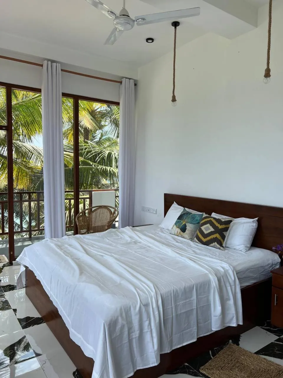Bed in Coconut Palm beach restaurant and rooms