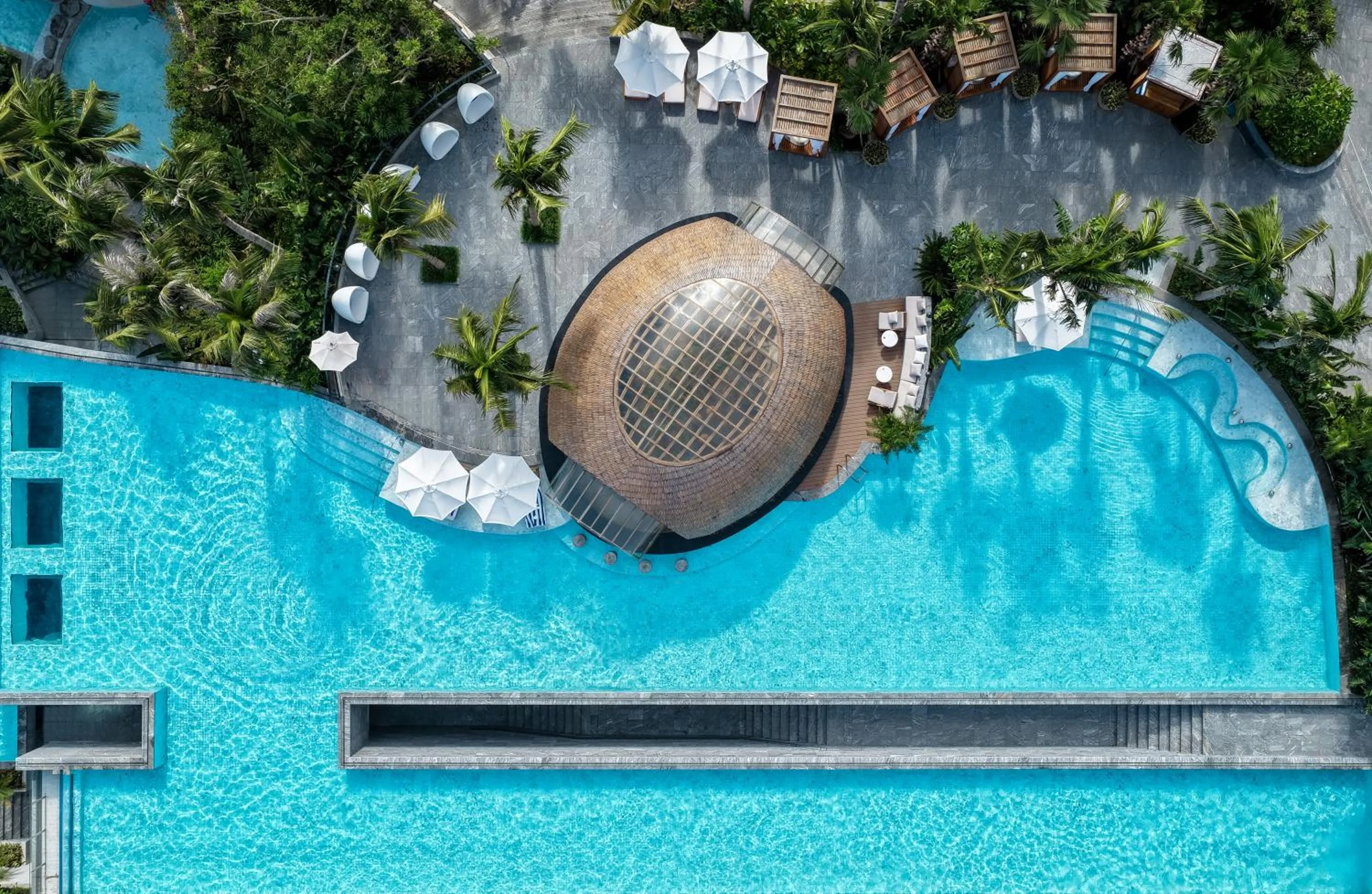 Swimming pool in Kimpton Aqeos Hainan by IHG