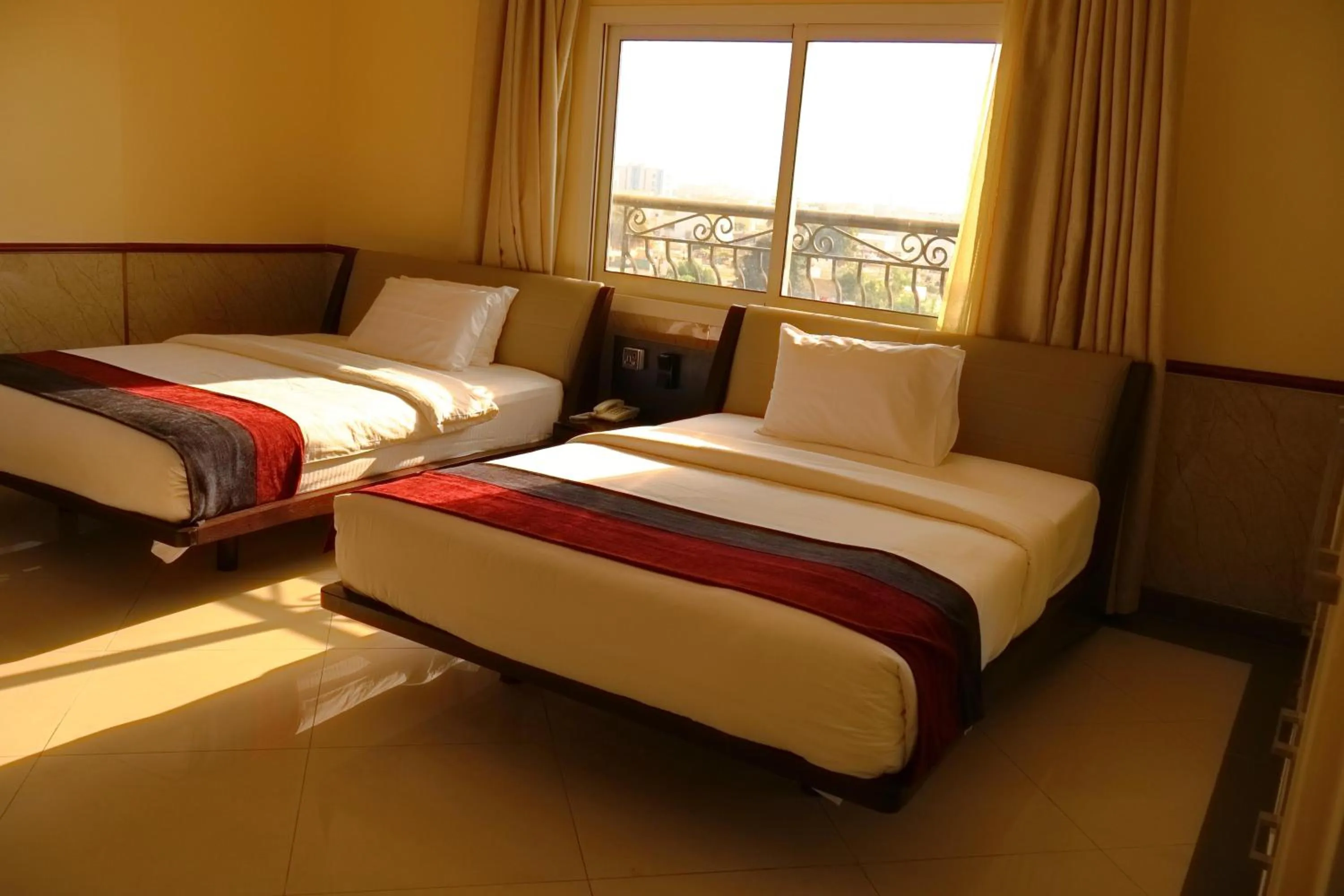 Bed in Claridge Star Hotel