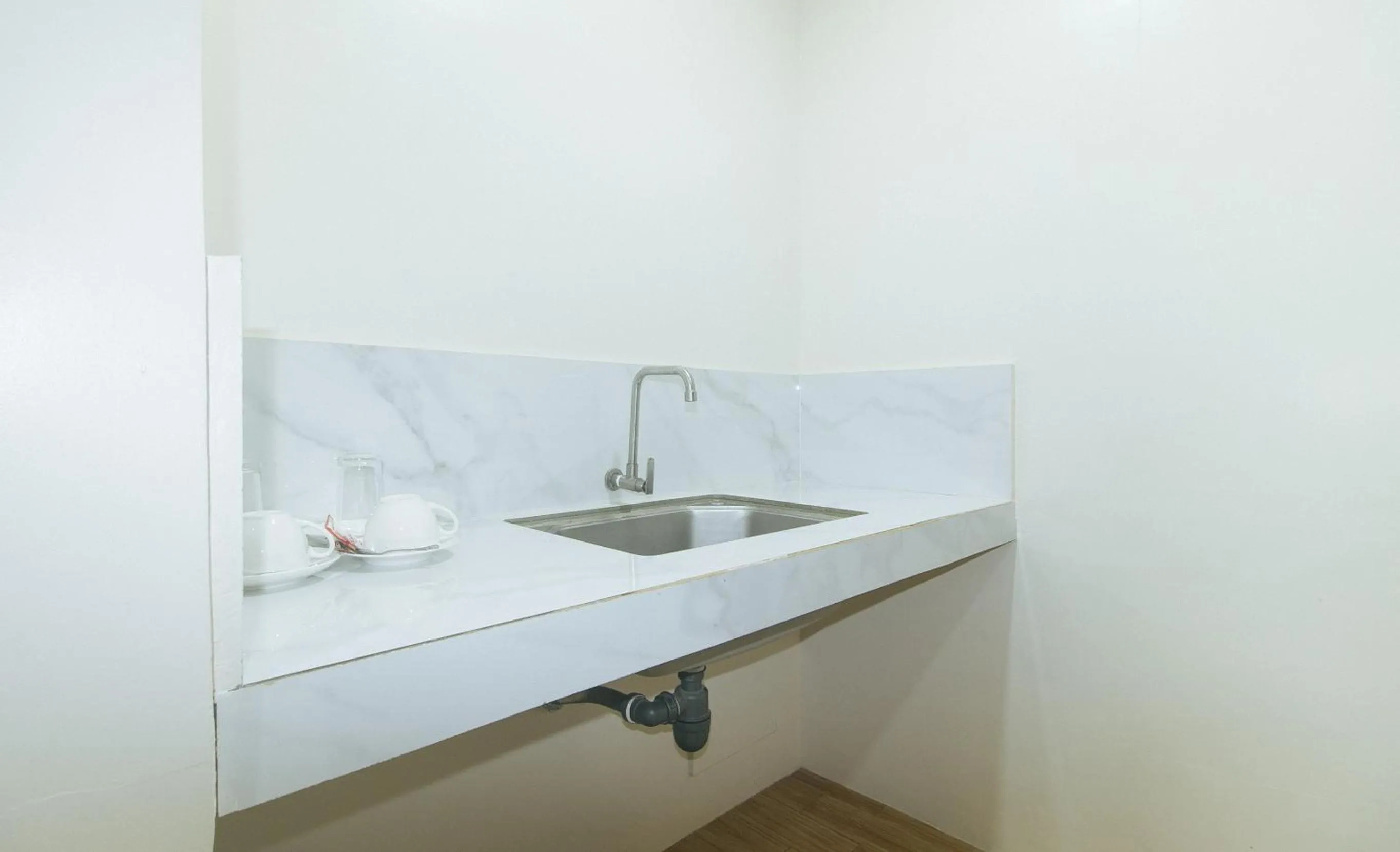 Kitchen or kitchenette in Avelida Homes by RedDoorz