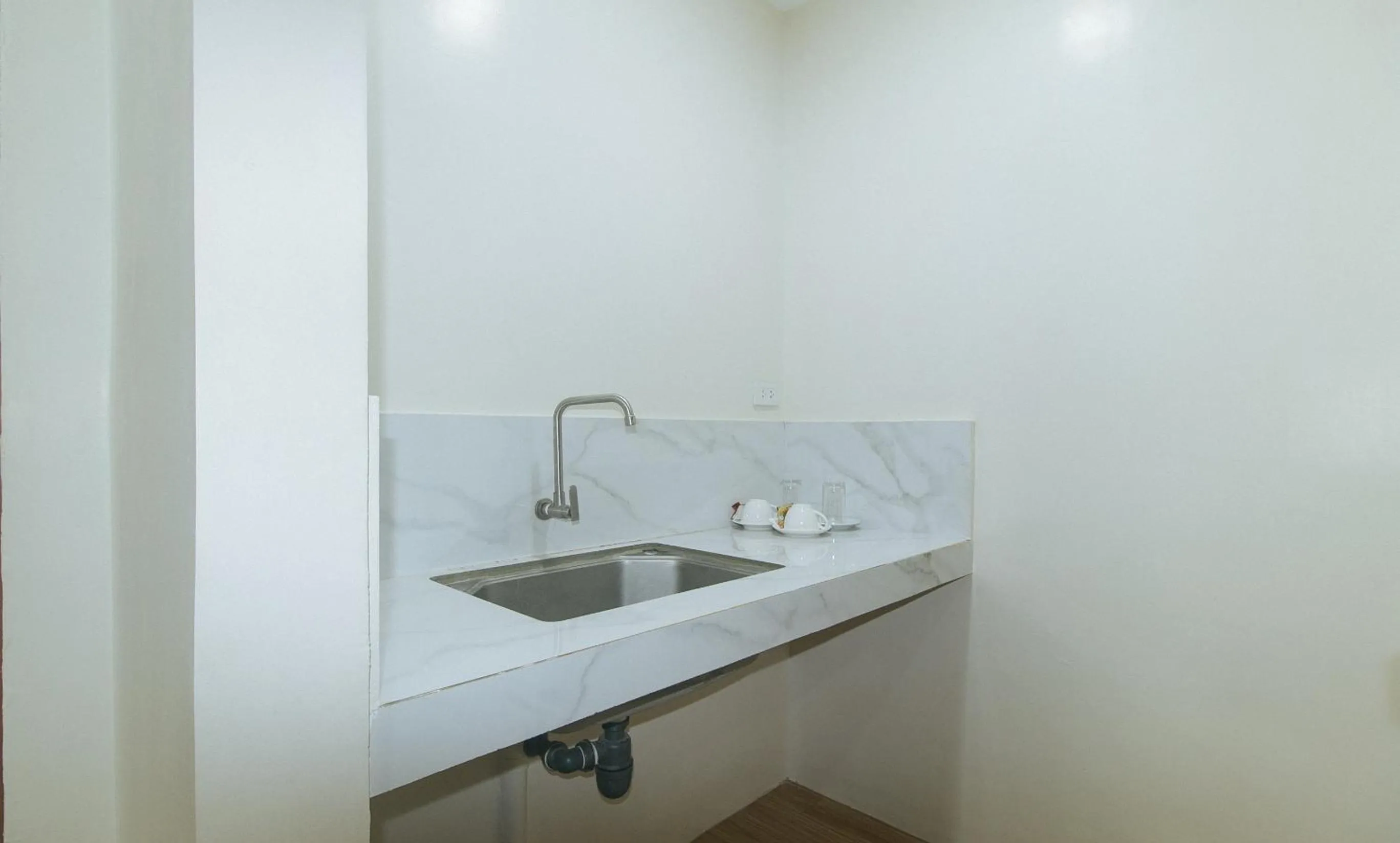 Kitchen or kitchenette in Avelida Homes by RedDoorz