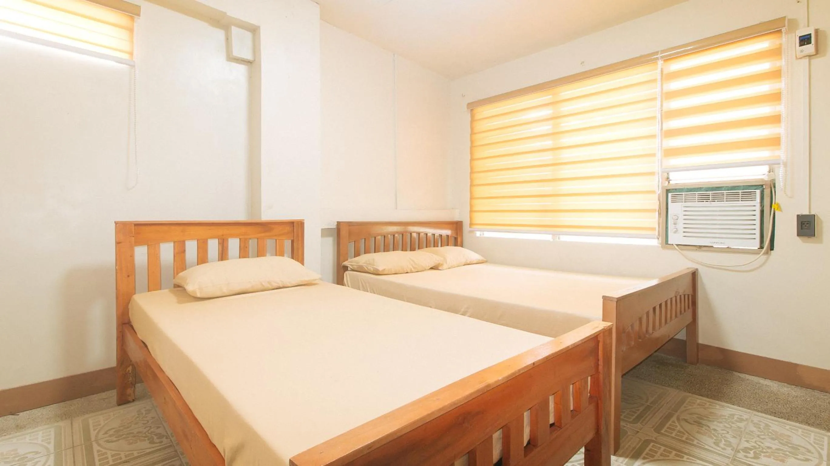 Bedroom, Bed in Kababayan Pensione House by RedDoorz