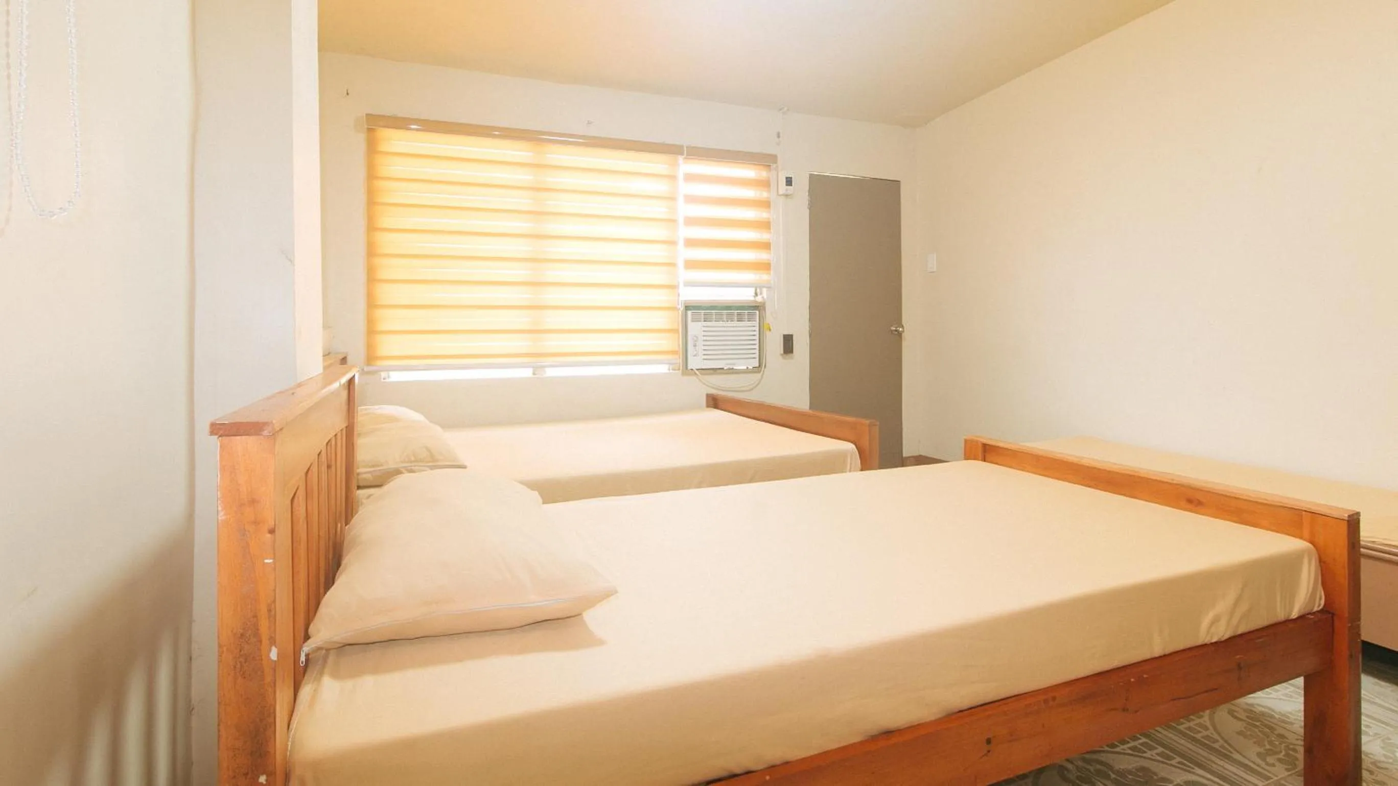 Bed in Kababayan Pensione House by RedDoorz