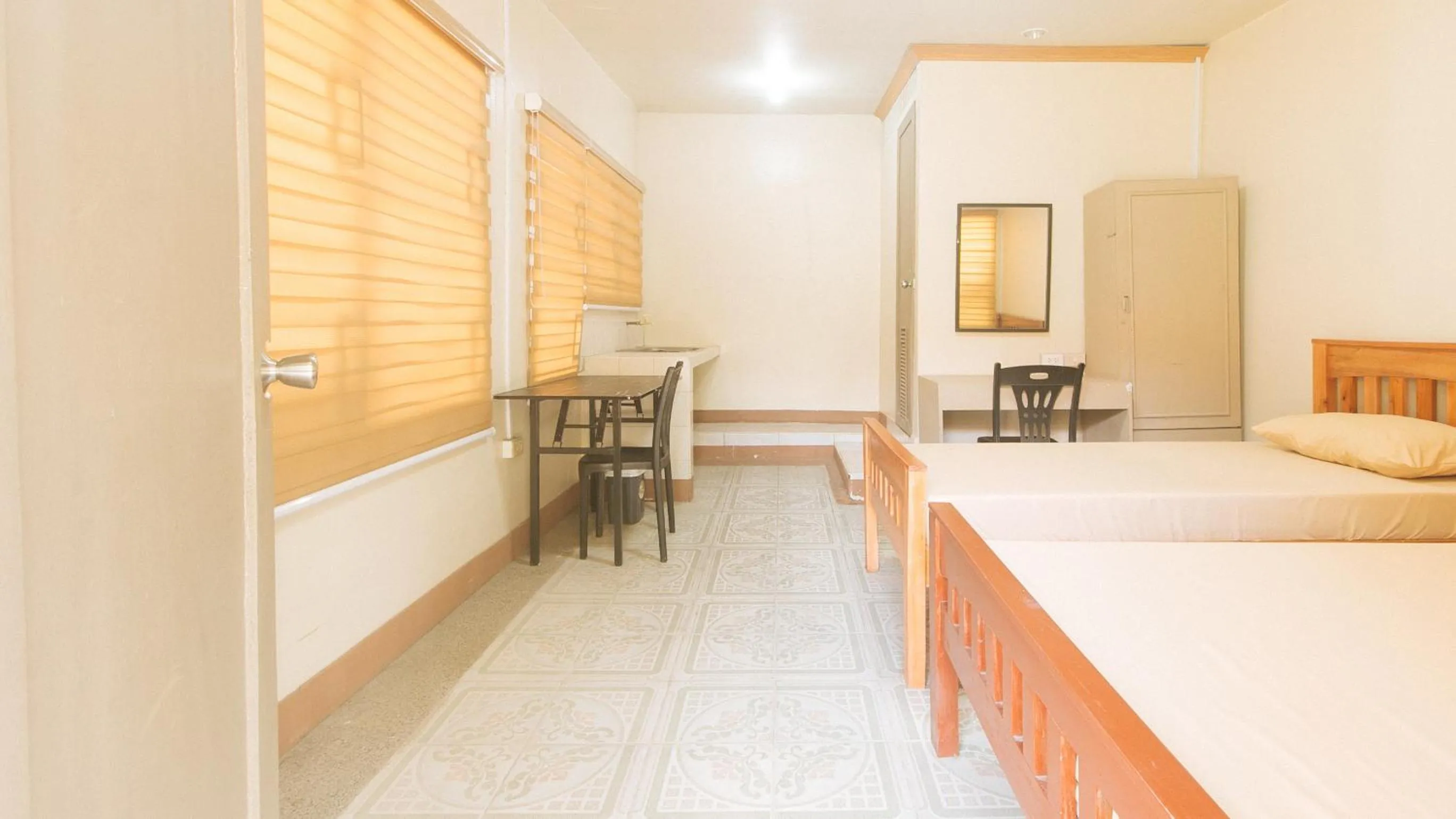 Bed in Kababayan Pensione House by RedDoorz