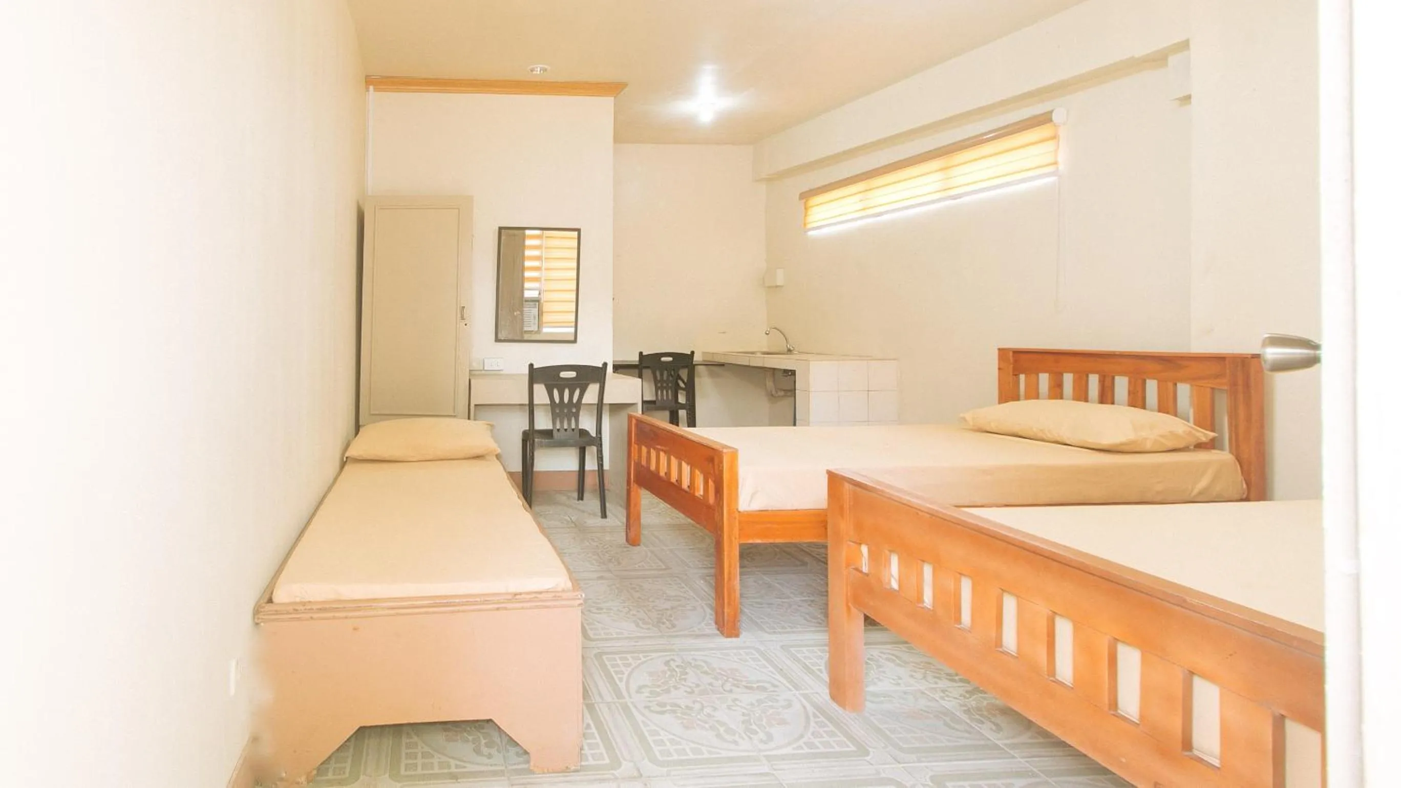 Bedroom, Bed in Kababayan Pensione House by RedDoorz