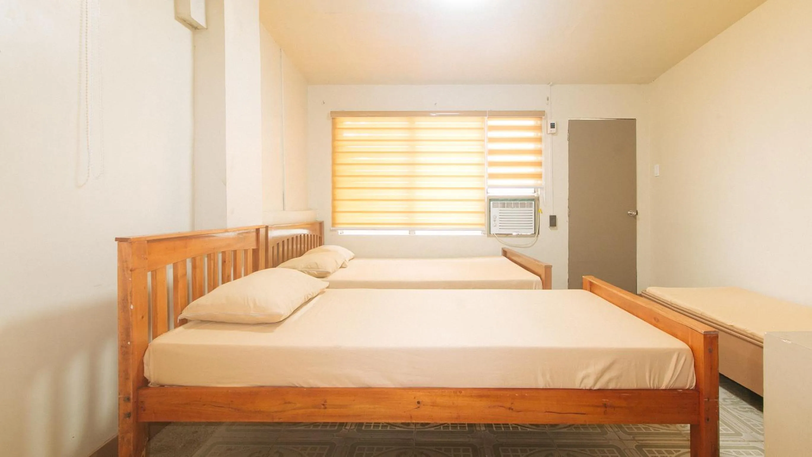 Bedroom, Bed in Kababayan Pensione House by RedDoorz