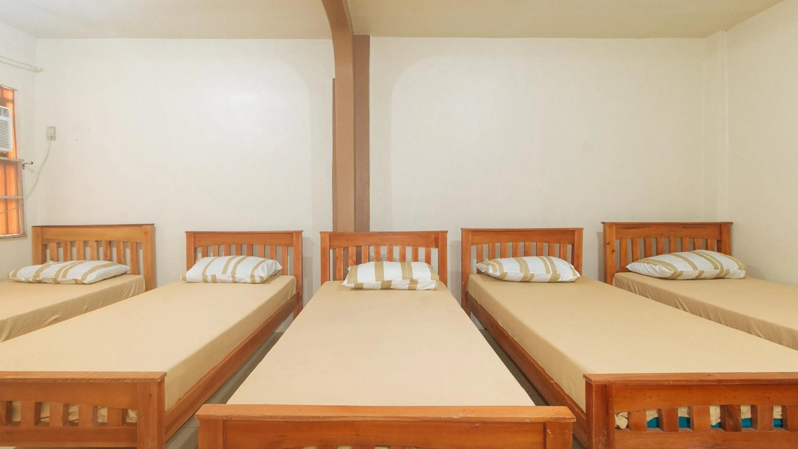 Bedroom, Bed in Kababayan Pensione House by RedDoorz