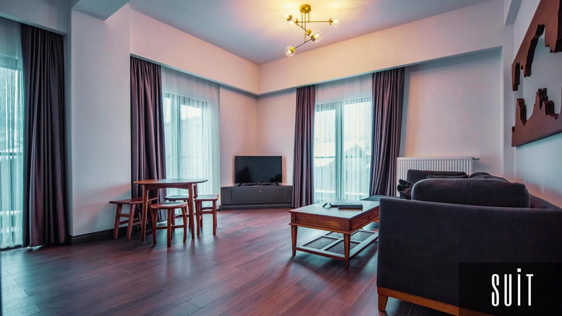 Seating area, Bed in V Orman Resort