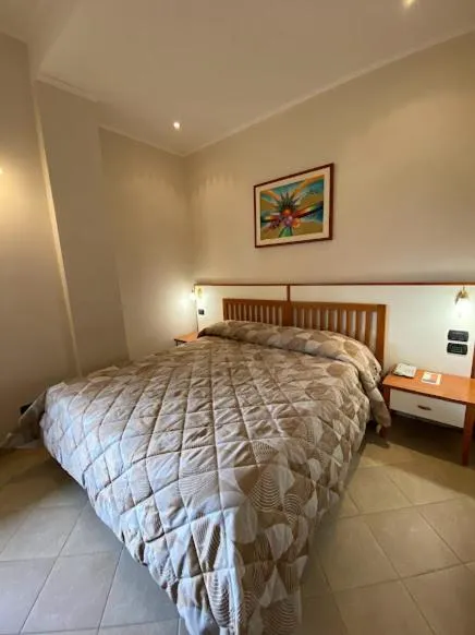 Bed in Hotel Residence Due Mari