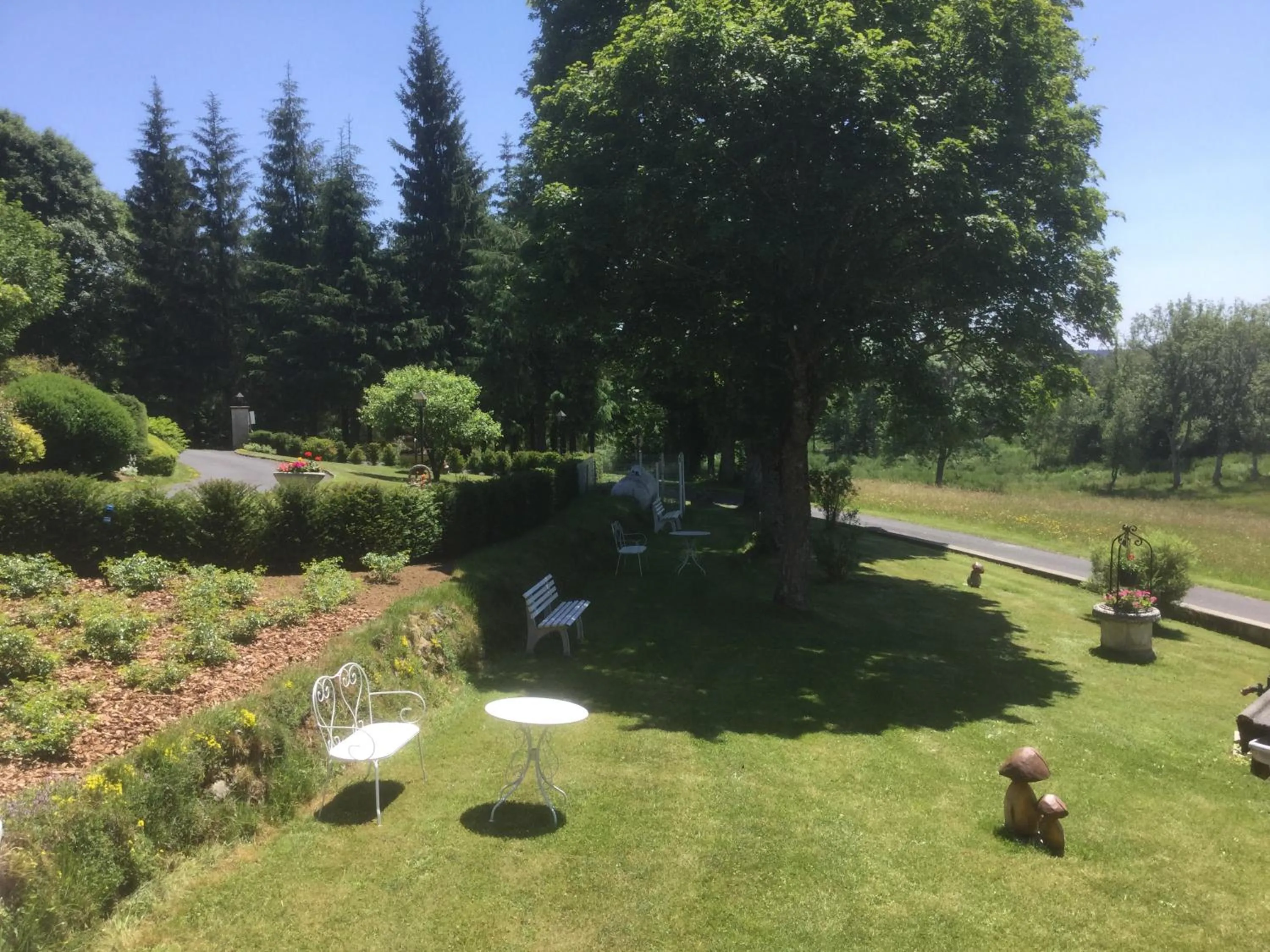 Garden view in Logis Hôtel Le Relais du Bois Vialotte