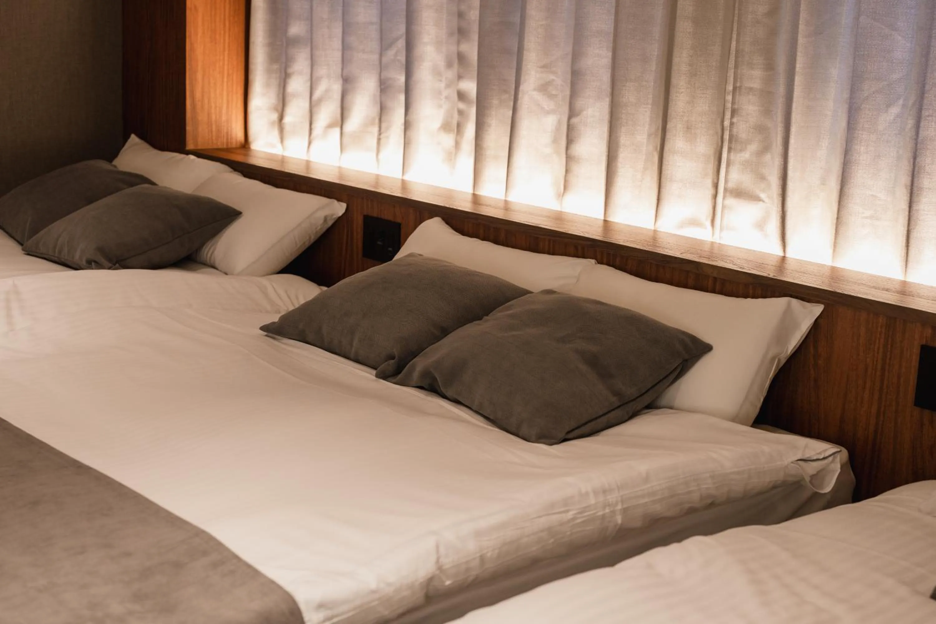 Bed in The LOFT INN HAKATA