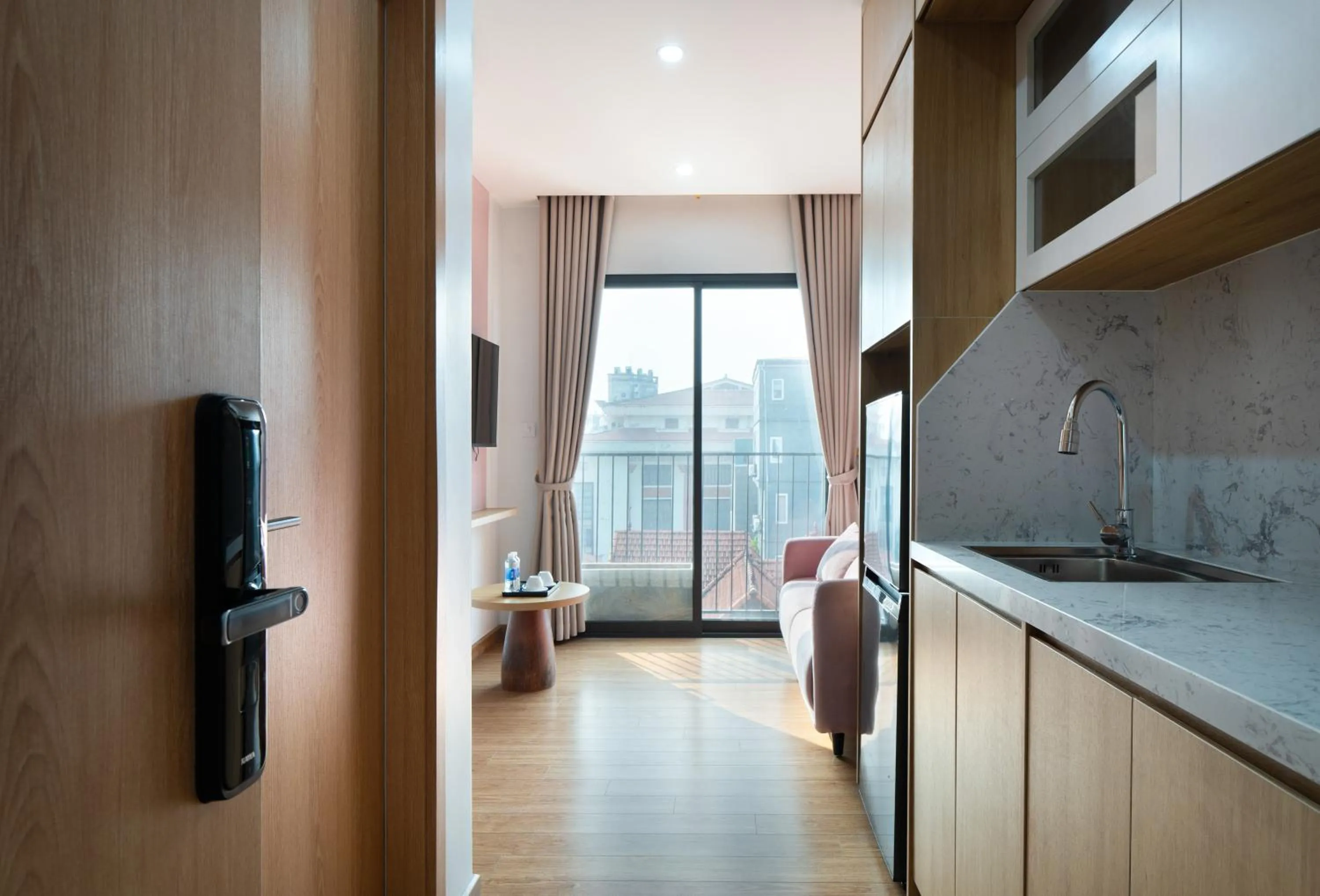 Kitchen or kitchenette in MOONLIT Suites Hotel by Luxe Paradise
