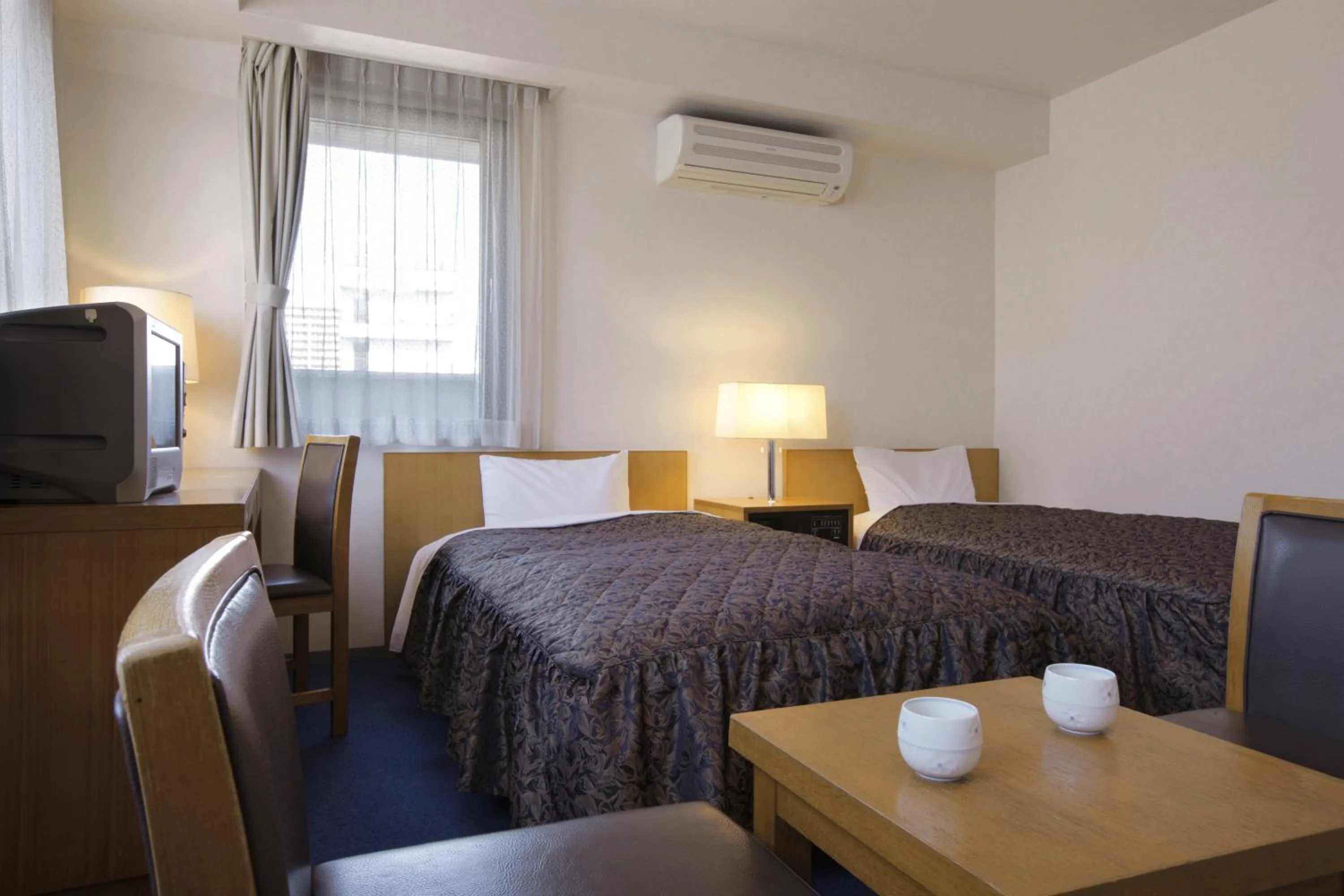 Bed in Sankei City Hotel Hachioji