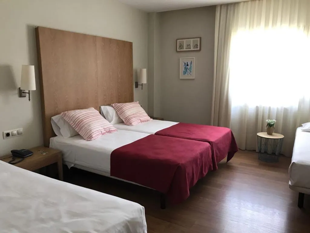 Bed in Hotel Entredos