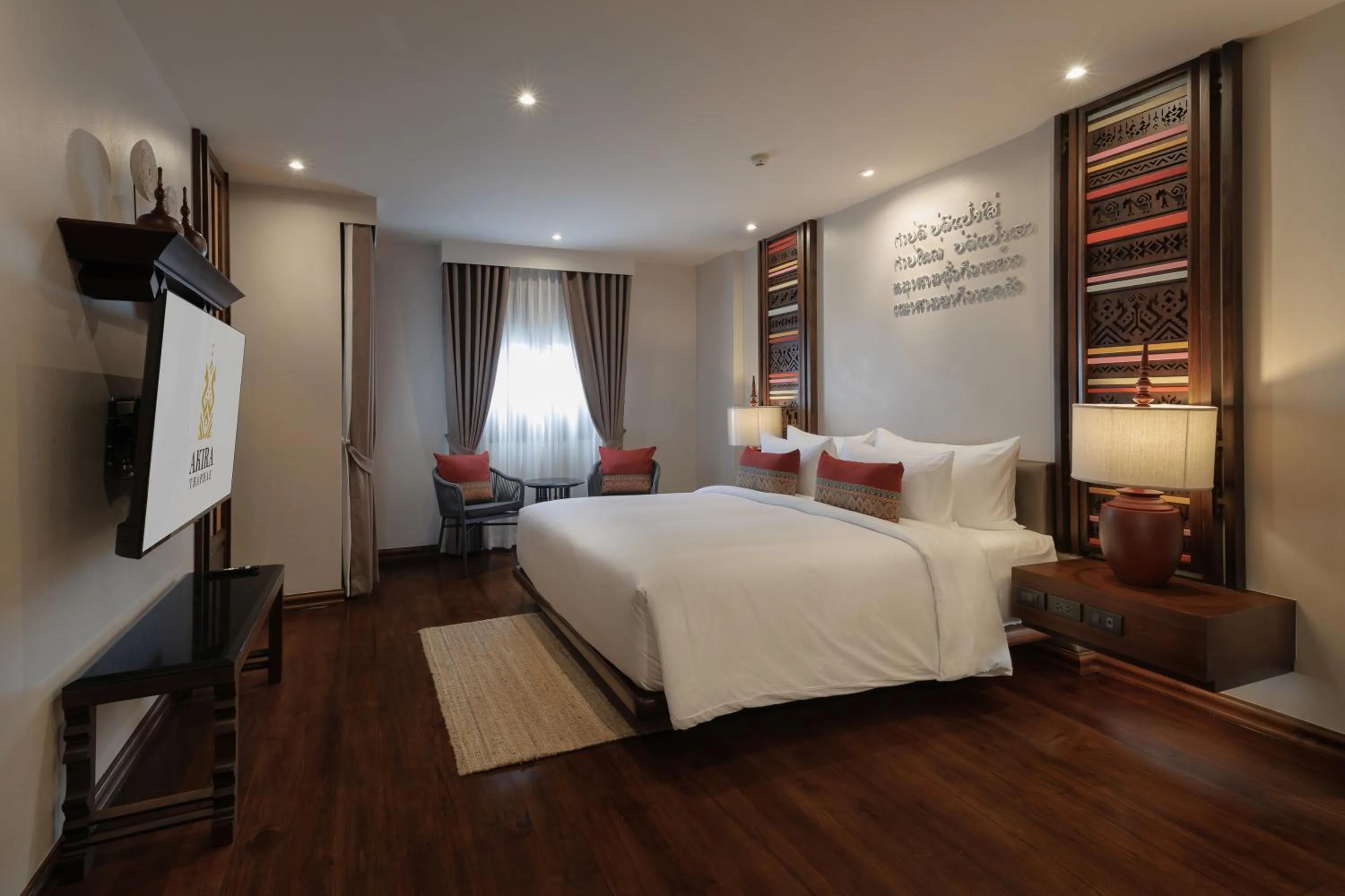 Bed in Akira Thaphae Hotel