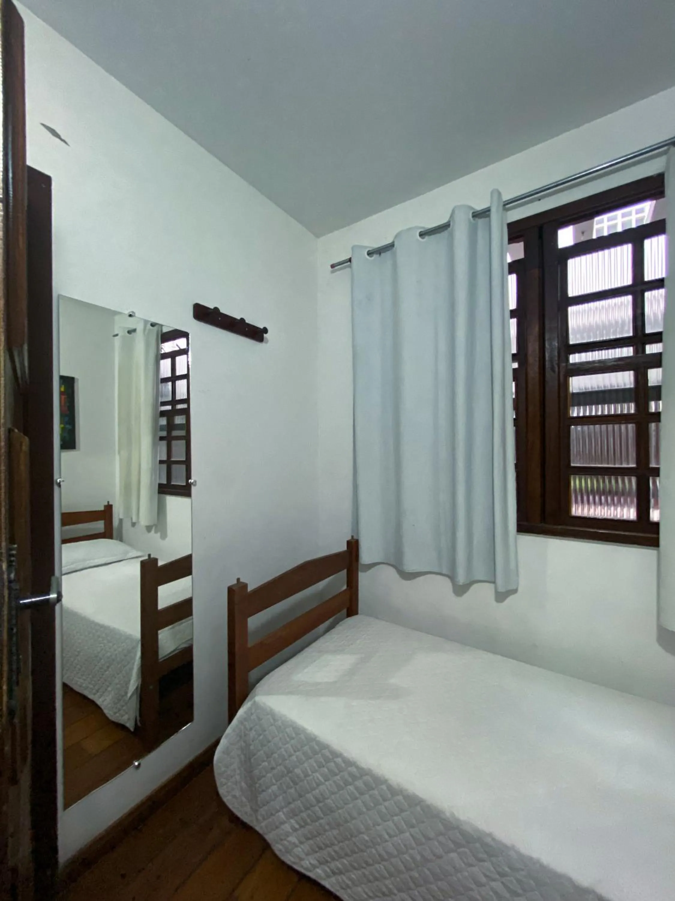 Bed in Pousada Flor de Lis