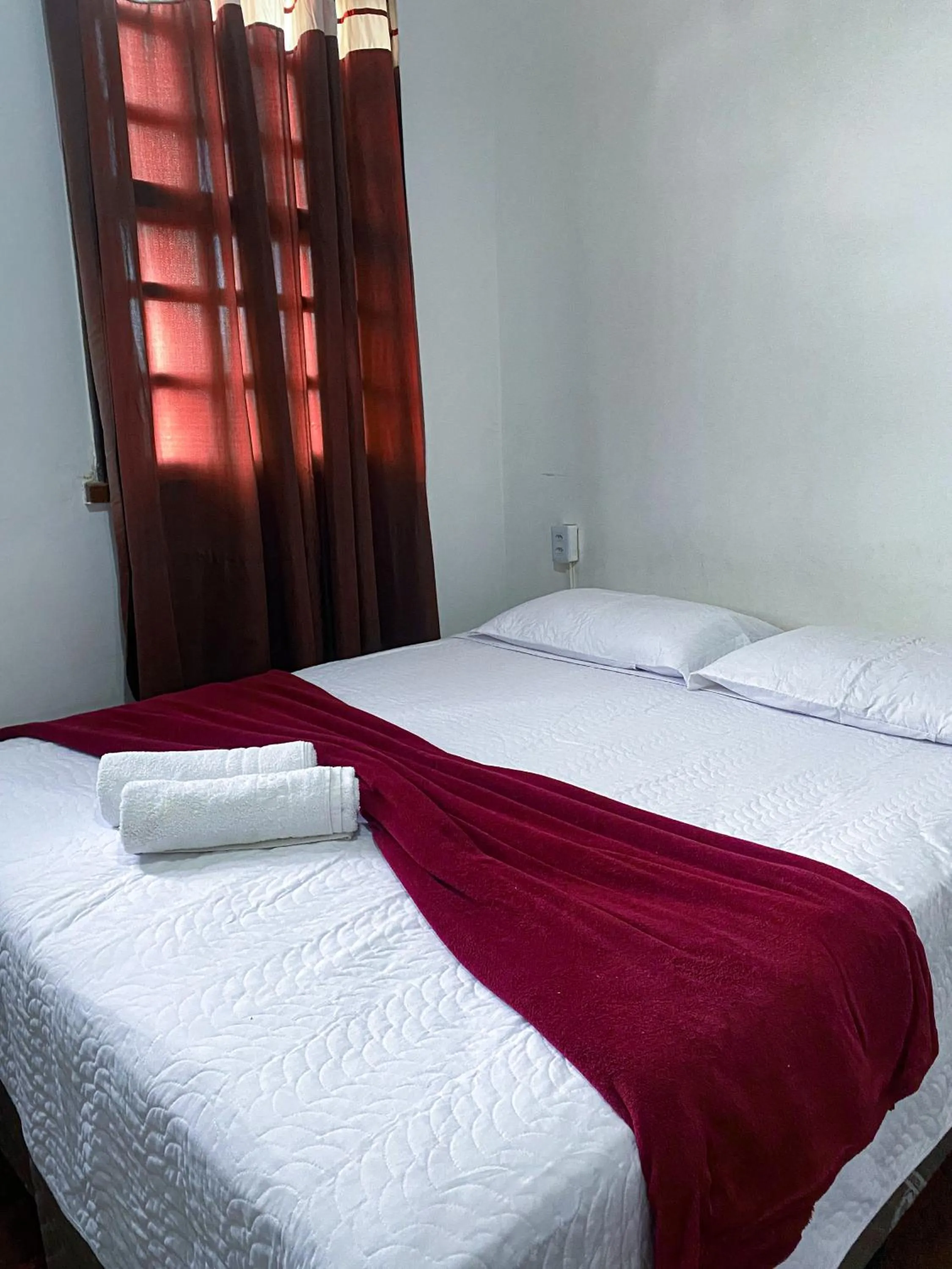 Bed in Pousada Flor de Lis