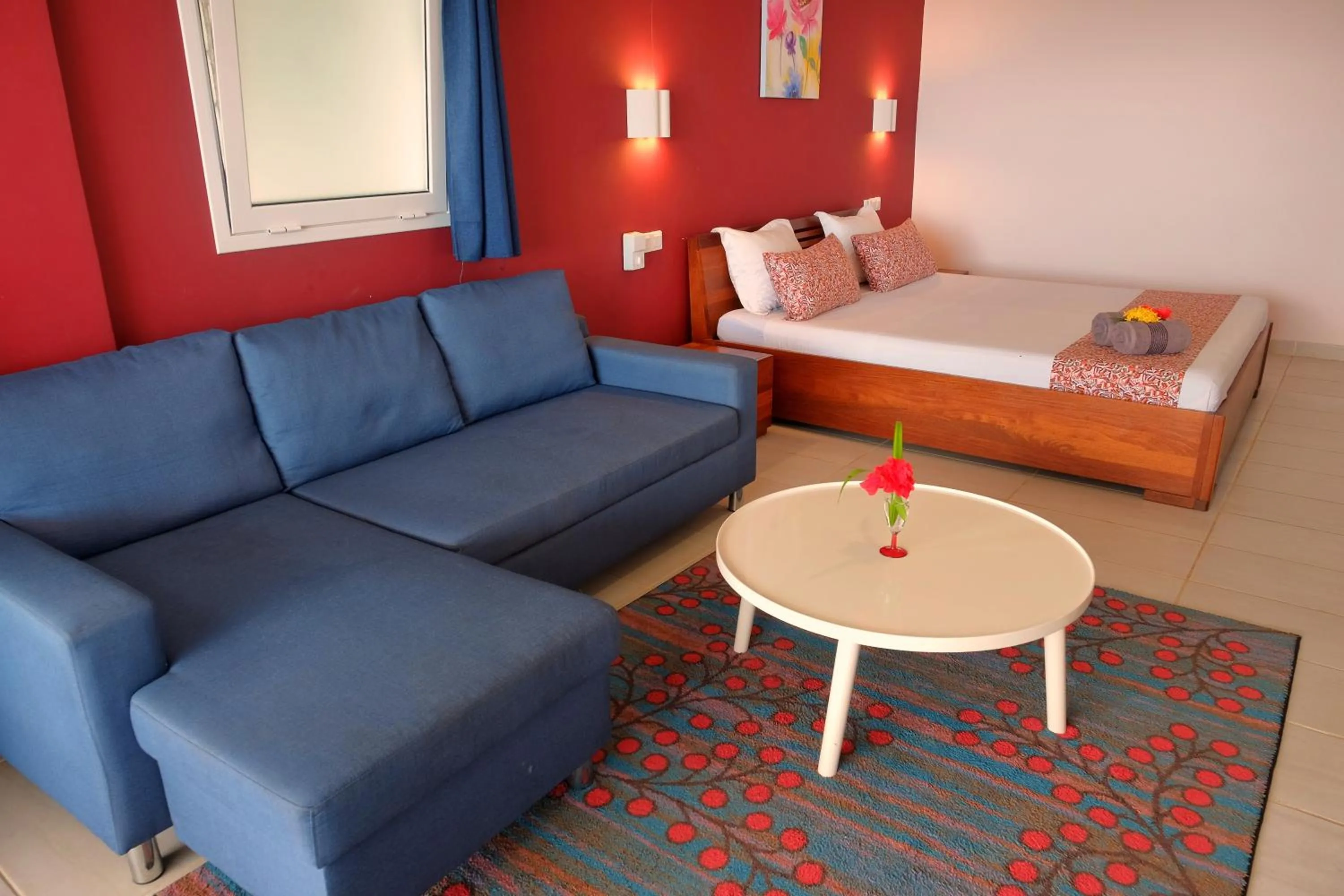 Living room, Bed in Hôtel Villa Les Orchidées